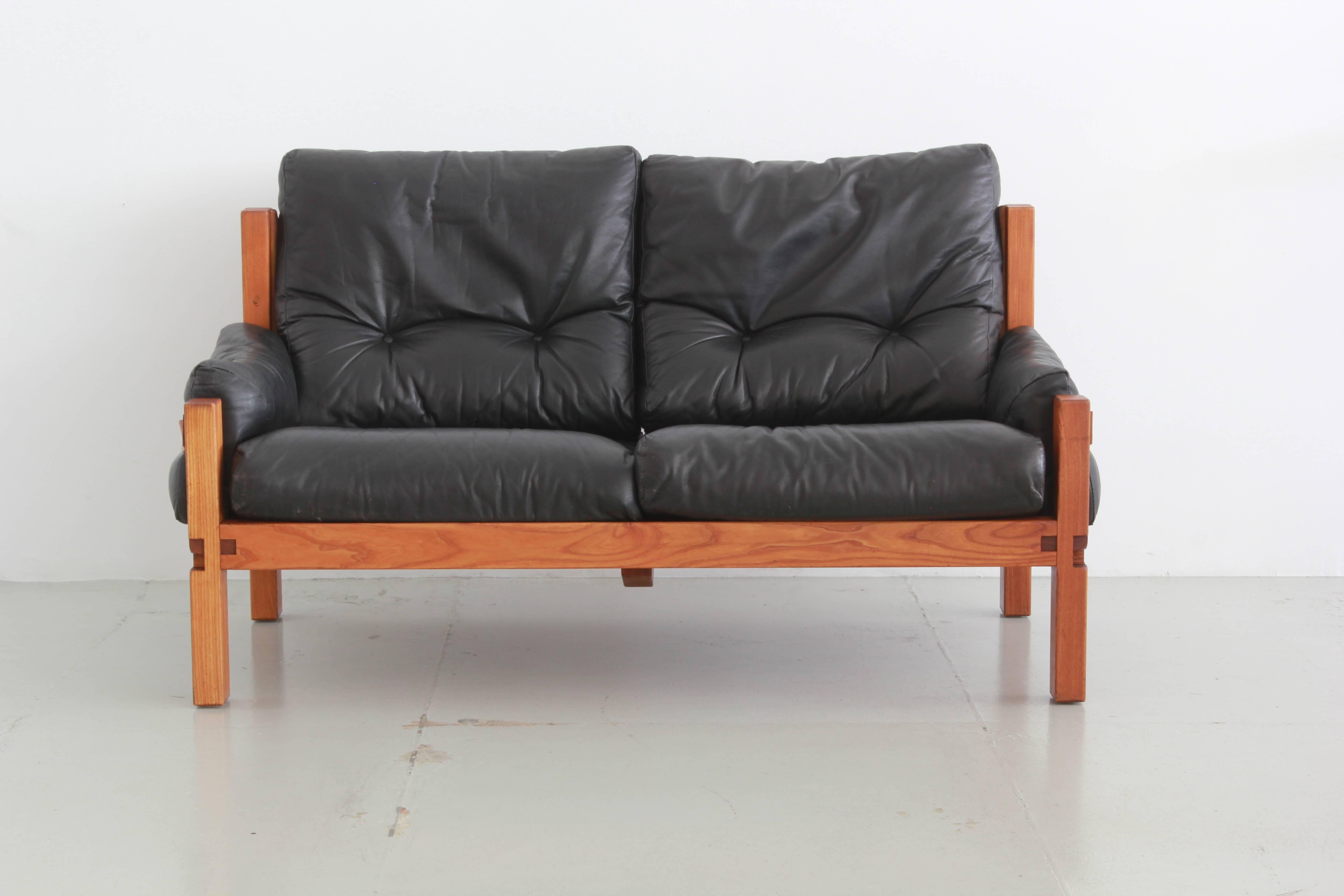 Two-seat sofa by Pierre Chapo. Solid elm and black leather with contrasting cognac leather side straps.
Vintage patina to leather - super soft. 