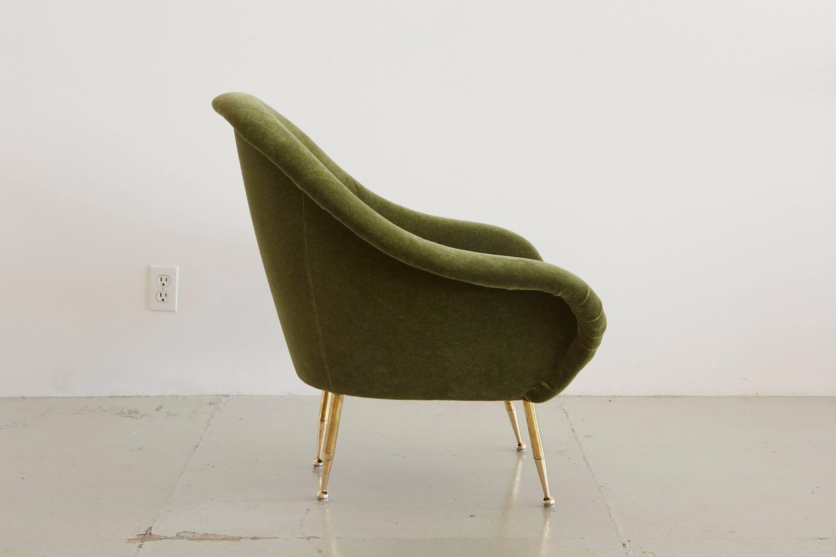 Italian lounge chair with beautiful curved lines, brass legs and newly upholstered in moss green mohair.