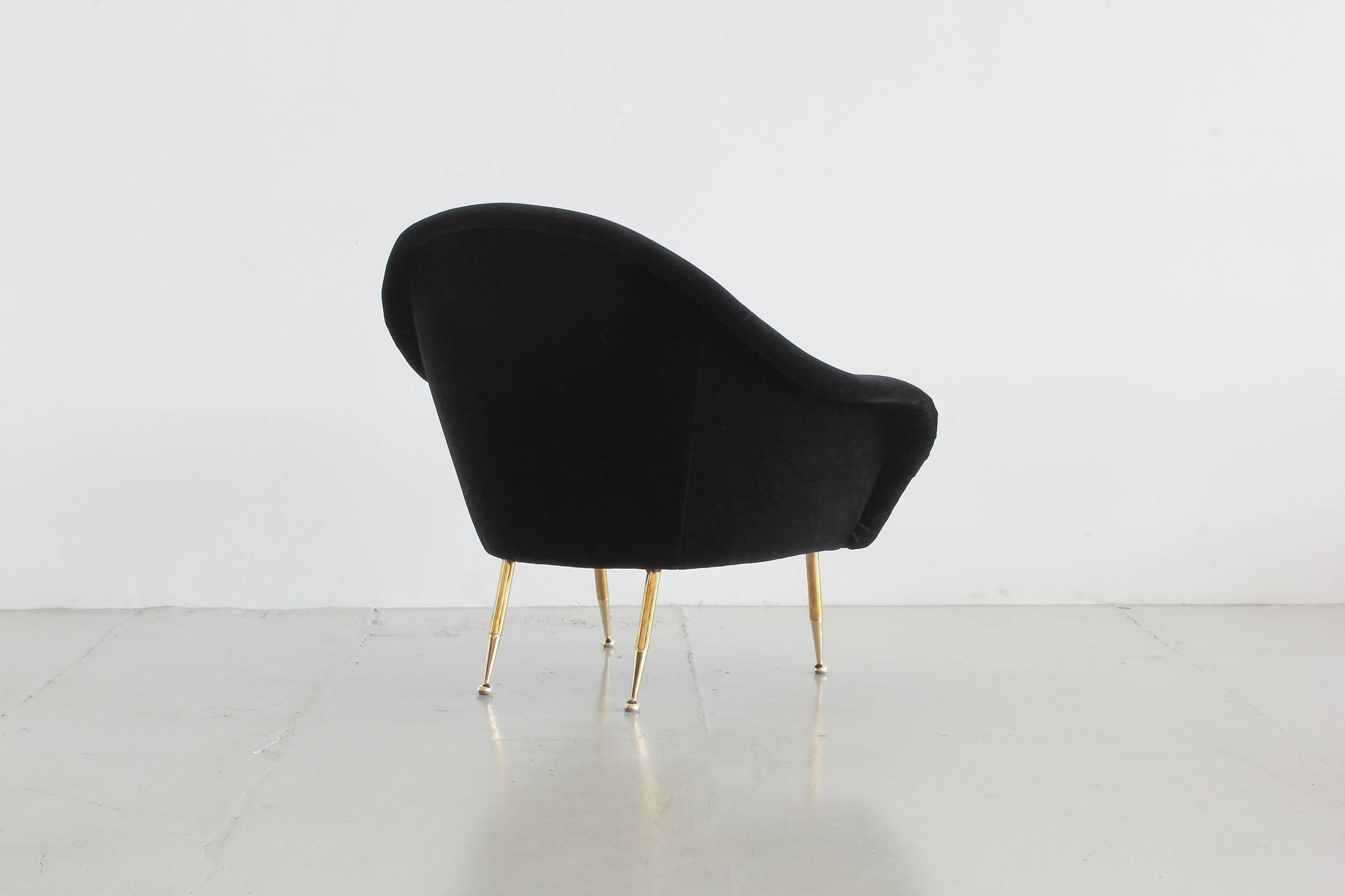 Italian lounge chair with beautiful curved lines, brass legs and newly upholstered in sexy black mohair.