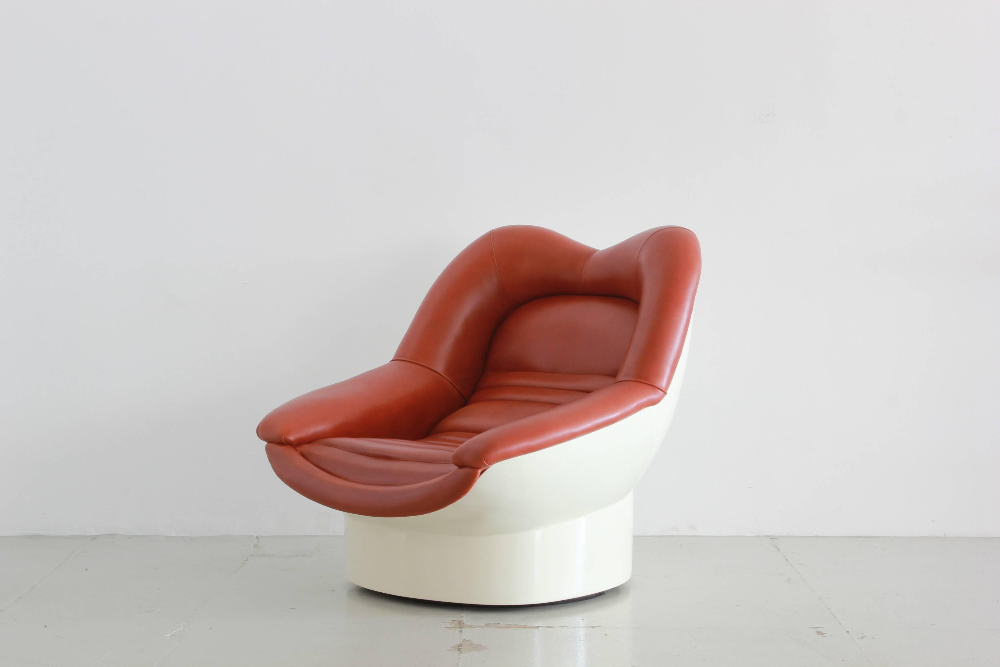 Incredible 1966 swivel chair by Italian designers Cesare Casati and Enzo Hybsch. Channel tufting leather and a curved reinforced fiberglass frame give this a one-of-a-kind modern look. A statement in any space.