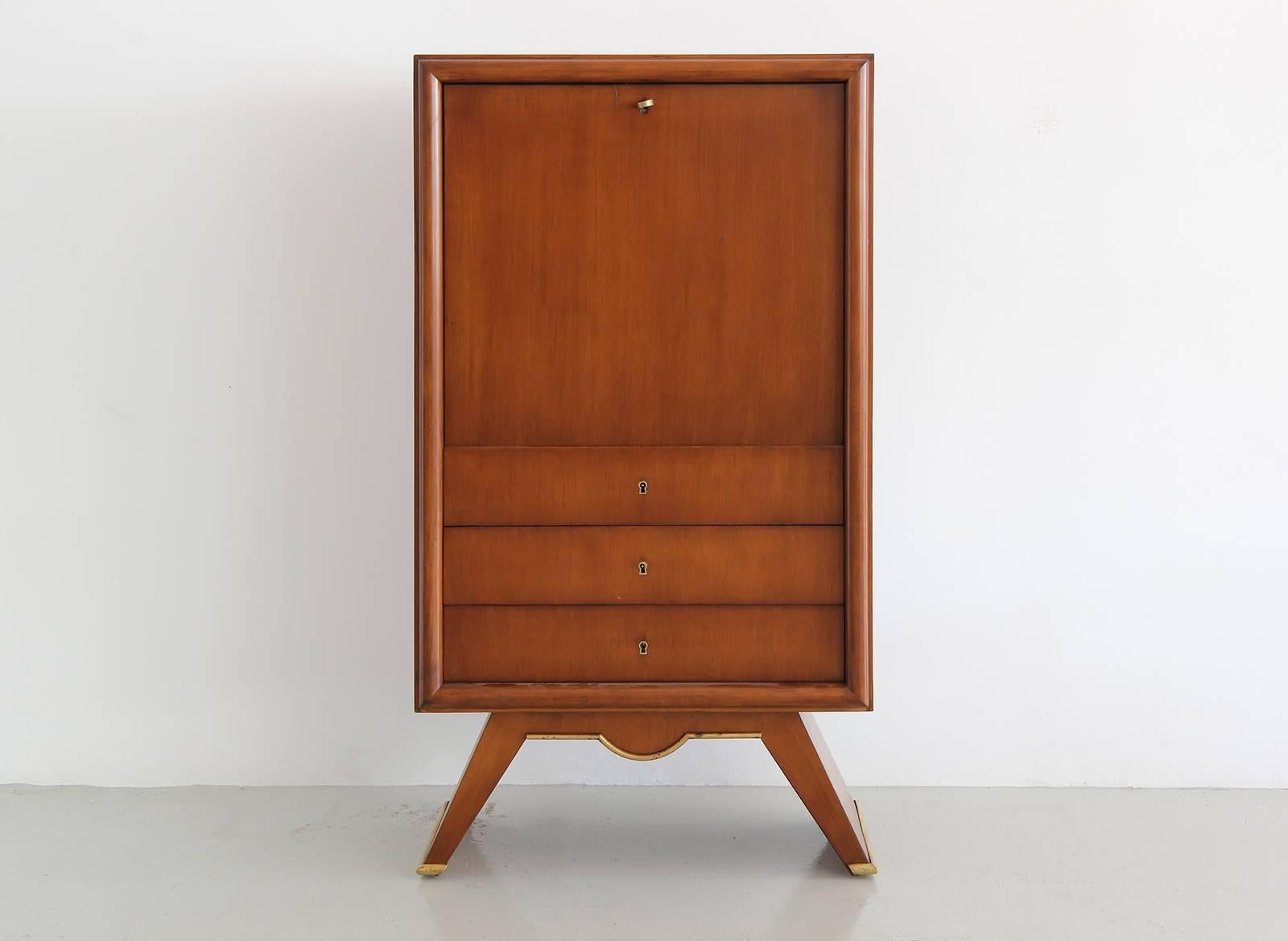 1940s Fantastic French secretary cabinet with sycamore veneer.
Drop down front with open storage and three lower drawers.
Wonderful angled lines with brass trim.
Newly refinished.