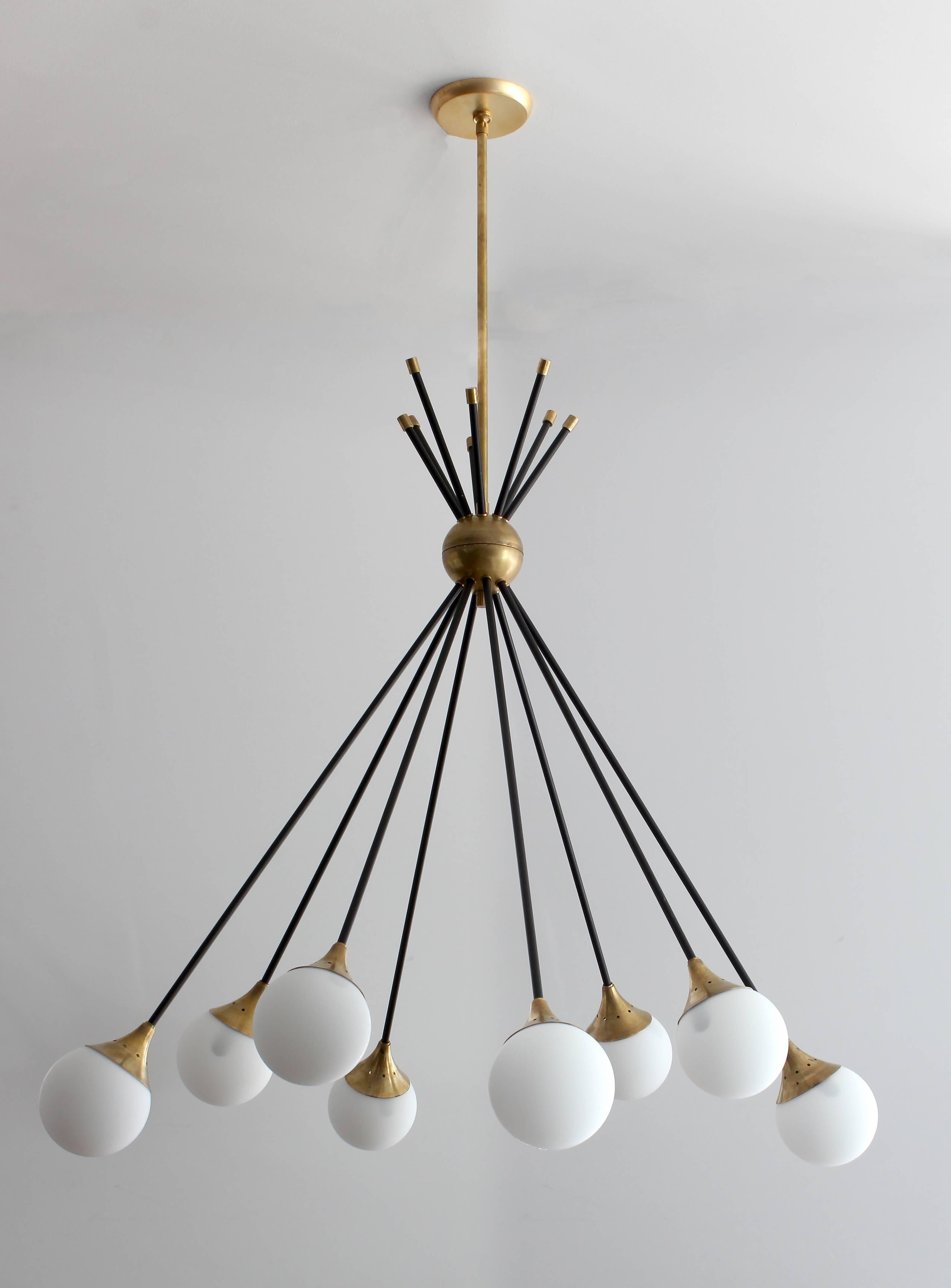 Exceptional Italian chandelier with signature Stilnovo style opaline glass globes and spring clasps in a dramatic drop down direction.  
Newly produced in Italy and rewired by Orange.
Includes eight opaline globe bulbs. 