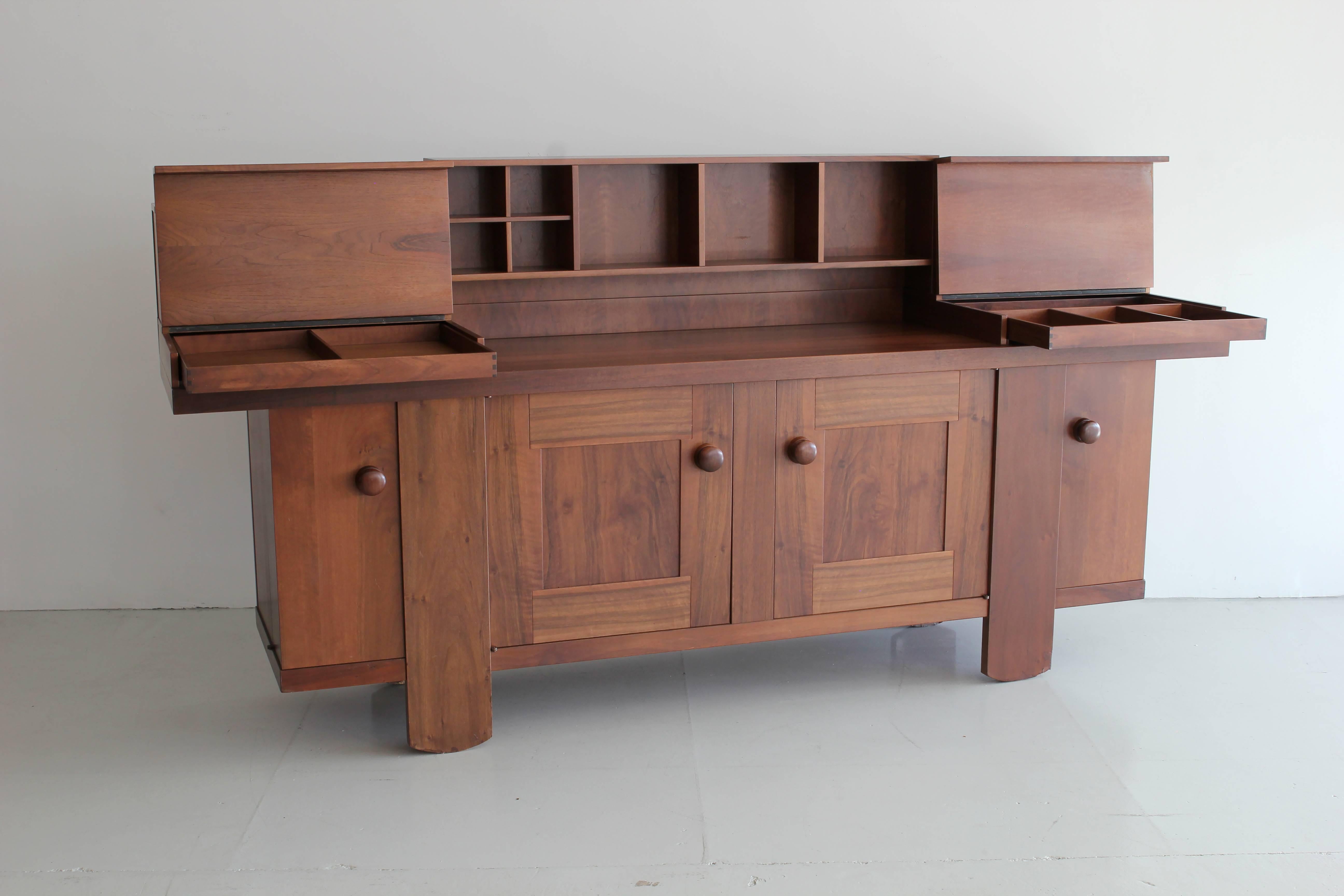 Large oak credenza designed by Silvio Coppola for Bernini in 1964. 
Open cubbies in various sizes on top of cabinet doors with adjustable shelving inside. 
Cabinet can be used without the cubbies attached if desired. 
 