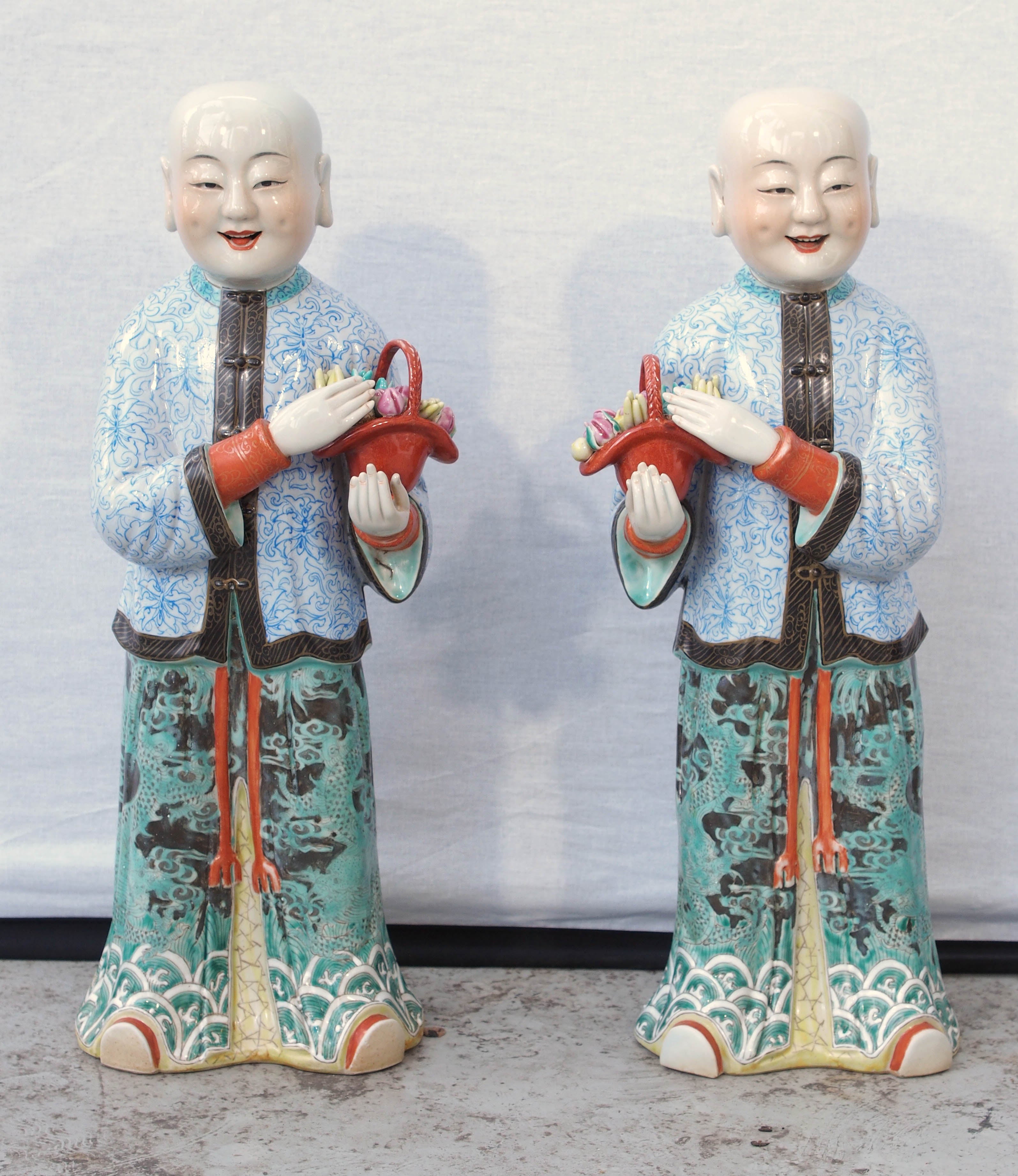 Pair of Chinese Famille Rose Boys with Baskets of Fruit