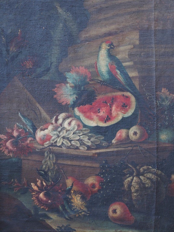 Italian school 18th century oil on canvas still life with bird and fruit in front of a column. In a period frame with faux marble panels and gilt tracery.