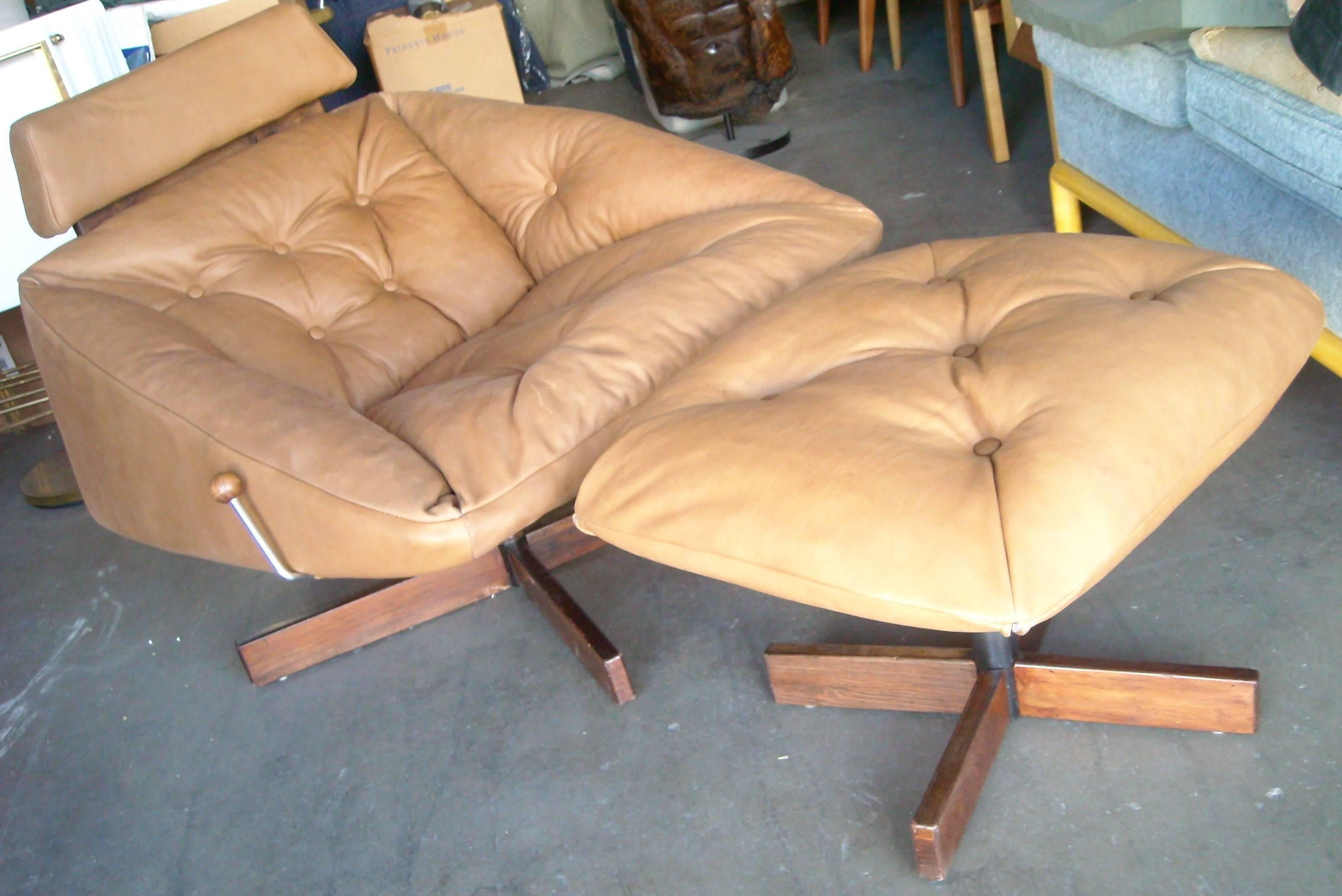 Great combination or rocking lounge chair with adjustable head rest. Signed.