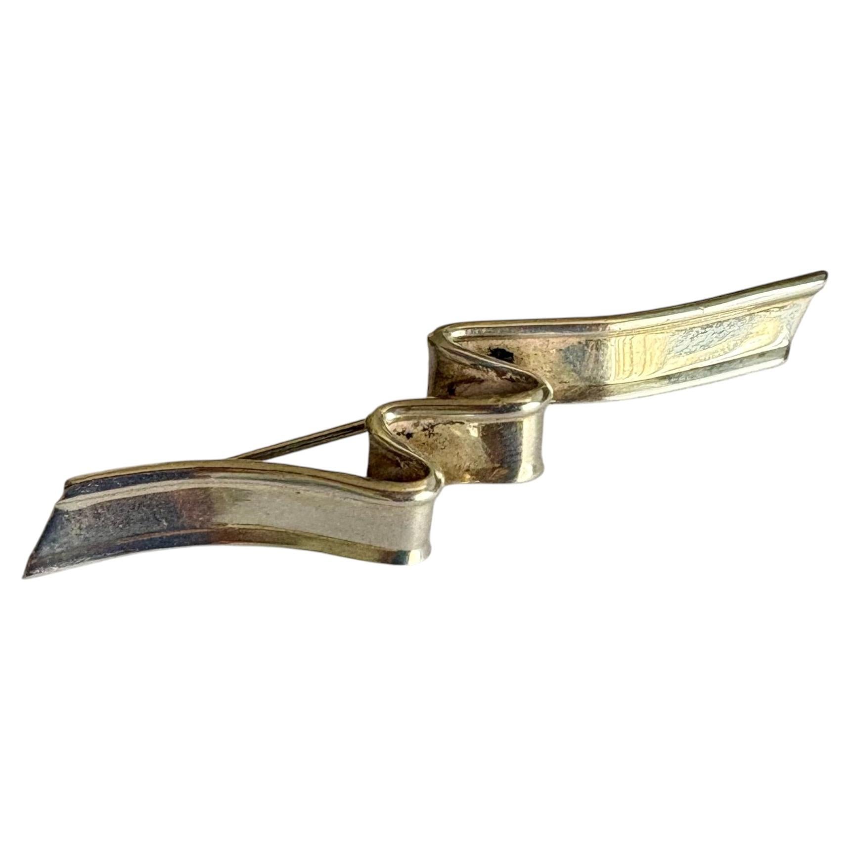 Tiffany & Co sterling silver ribbon , wave brooch , pin . For Sale