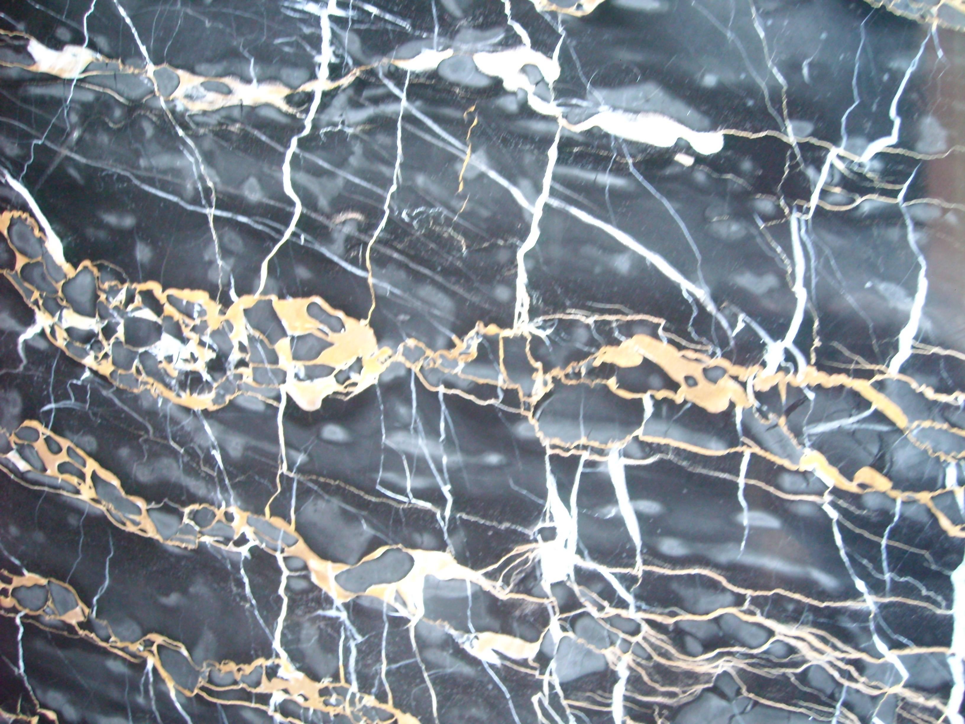Amazing black with white and cream vanes marble top, (one of the best grades in marble in the world) coffee table designed by Edward Wormley.
