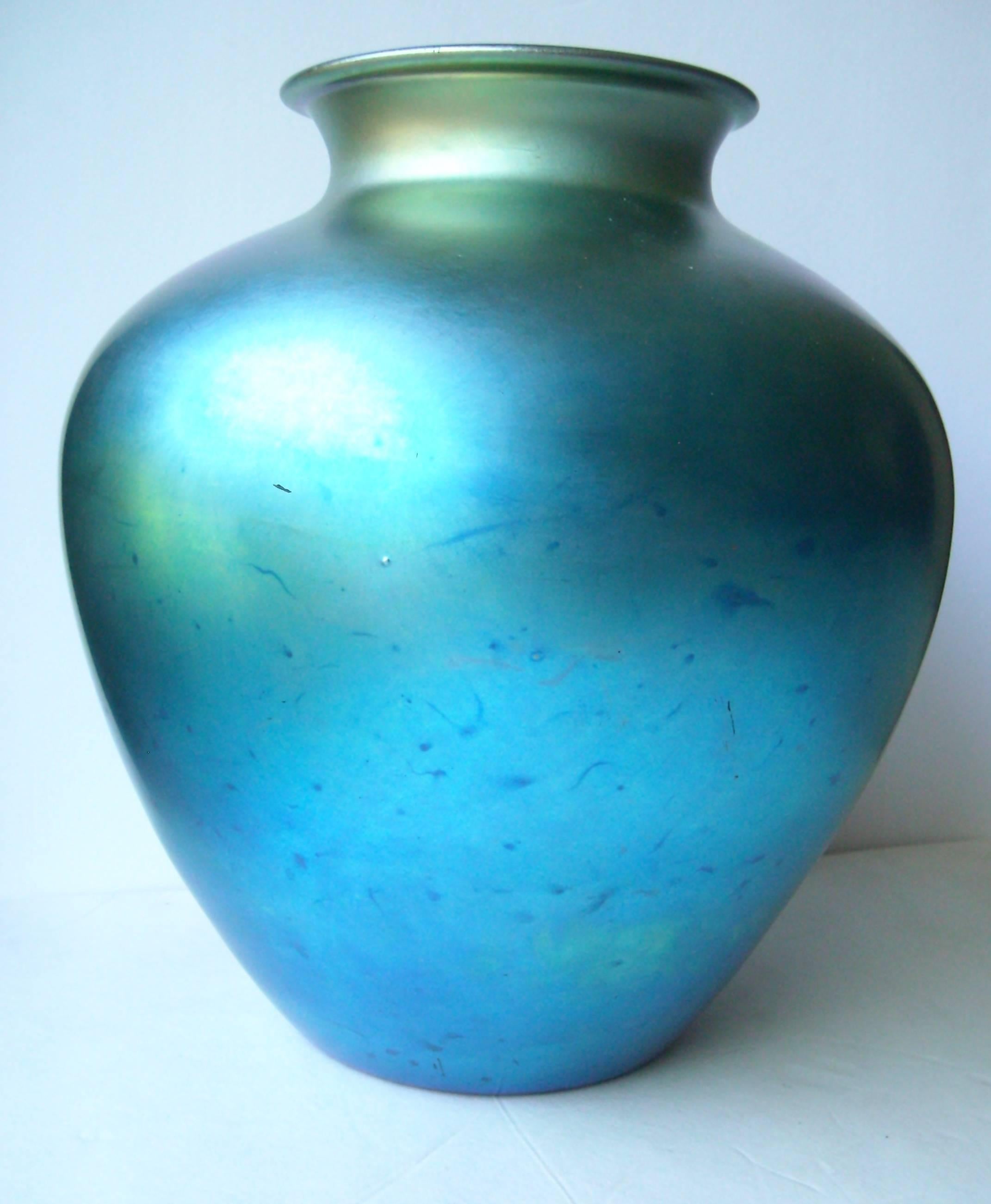This is a very well-known piece for Steuben, it was many years in production in many different colors, but this is a very large vase. Signed and numbered as shown.