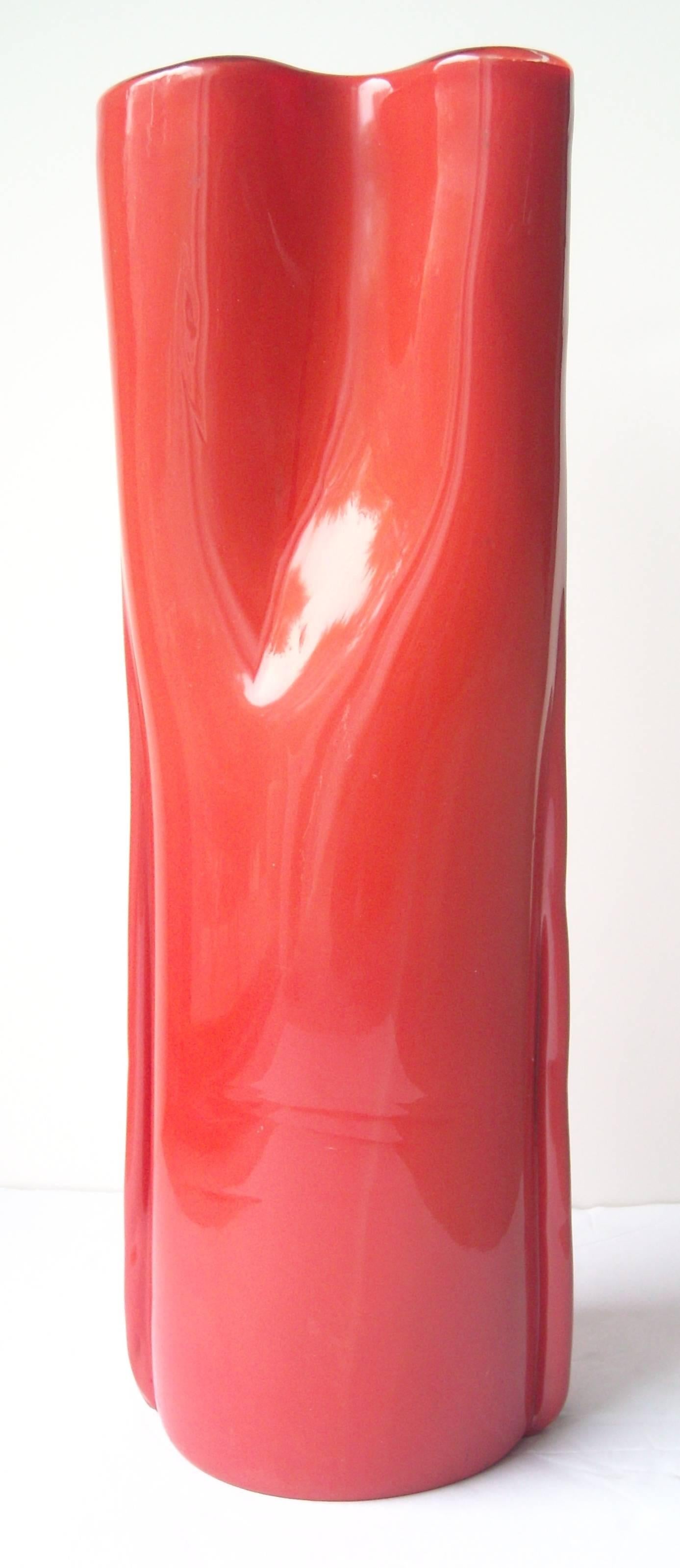 This is a beautiful Venini red glass vase, signed Venini, Italia in diamond point at bottom. It measures approximate, almost 16 inches high. Little more than 15 3/4.Designed by Toni Zucchini.