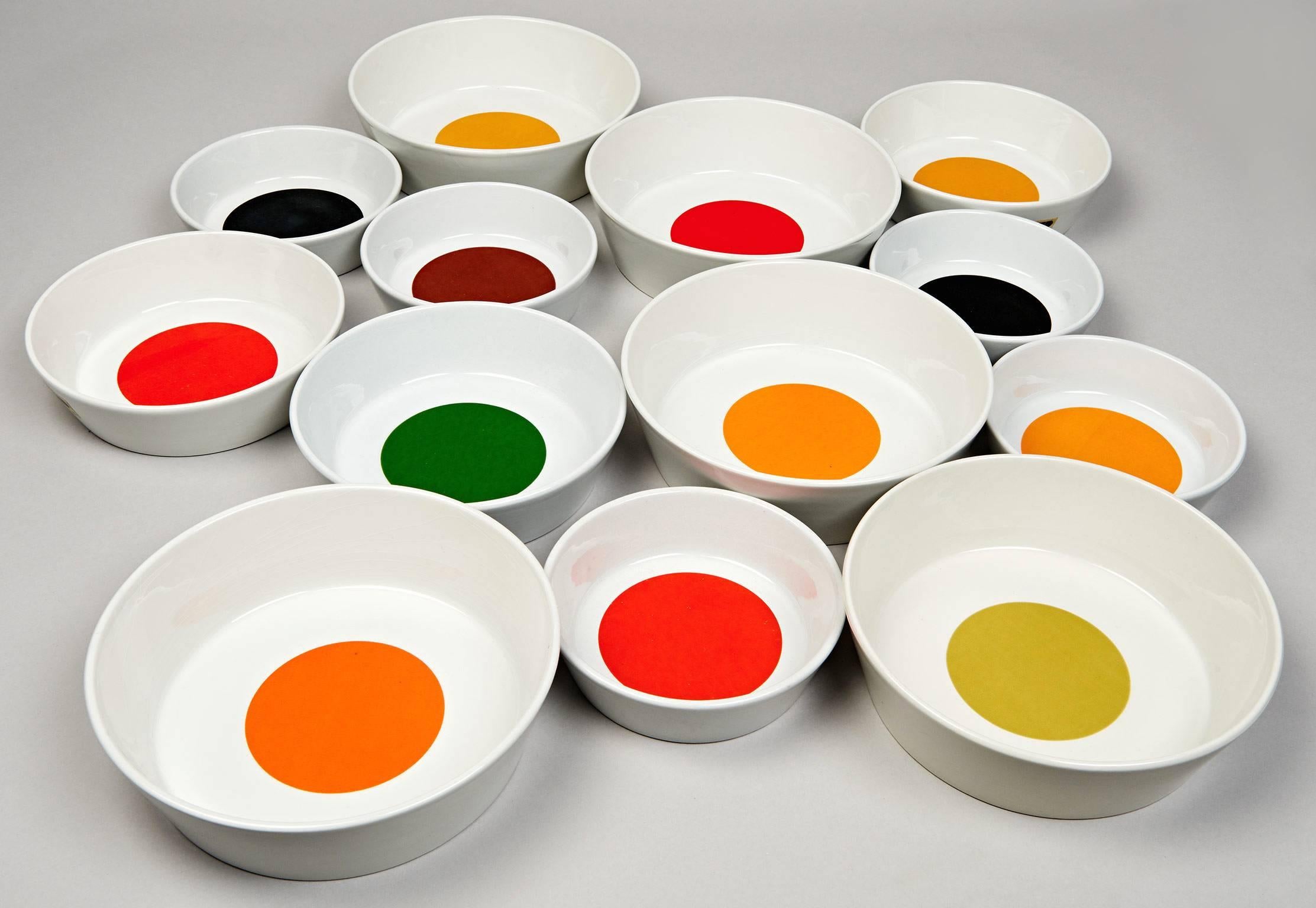 These 13 porcelain bowls are each decorated with a roundel of pure color. Designed by Gio Ponti and produced by Ceramica Franco Pozzi in the late 1960s, these bowls, especially when displayed together have the appeal of minimalist art. This
