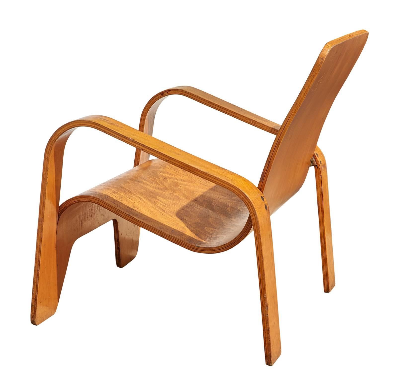 The Lawo chair, so named because it was made of LA-minated WO-od, was brilliantly constructed from a single sheet of birch plywood, which is cut and then bent in different planes to create the seating surfaces, arms, and legs of the chair. The rear