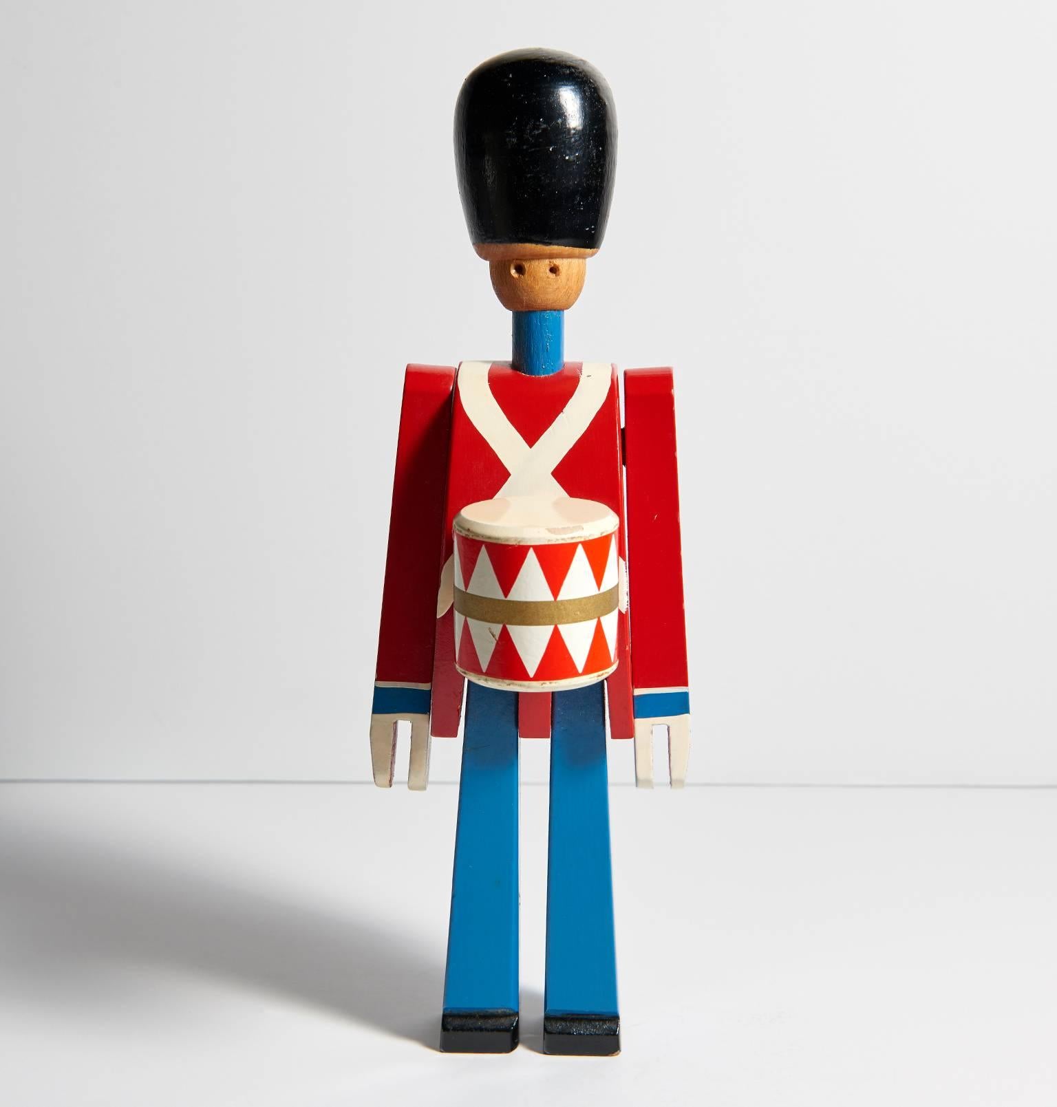 Two life-size versions of Kay Bojesen's iconic wooden Guardsmen flanked the entrance to his Copenhagen shop, which was located near the Royal Palace. This drummer is in lovely condition. Impressed on the inside of one leg with Kay Bojesen's mark.