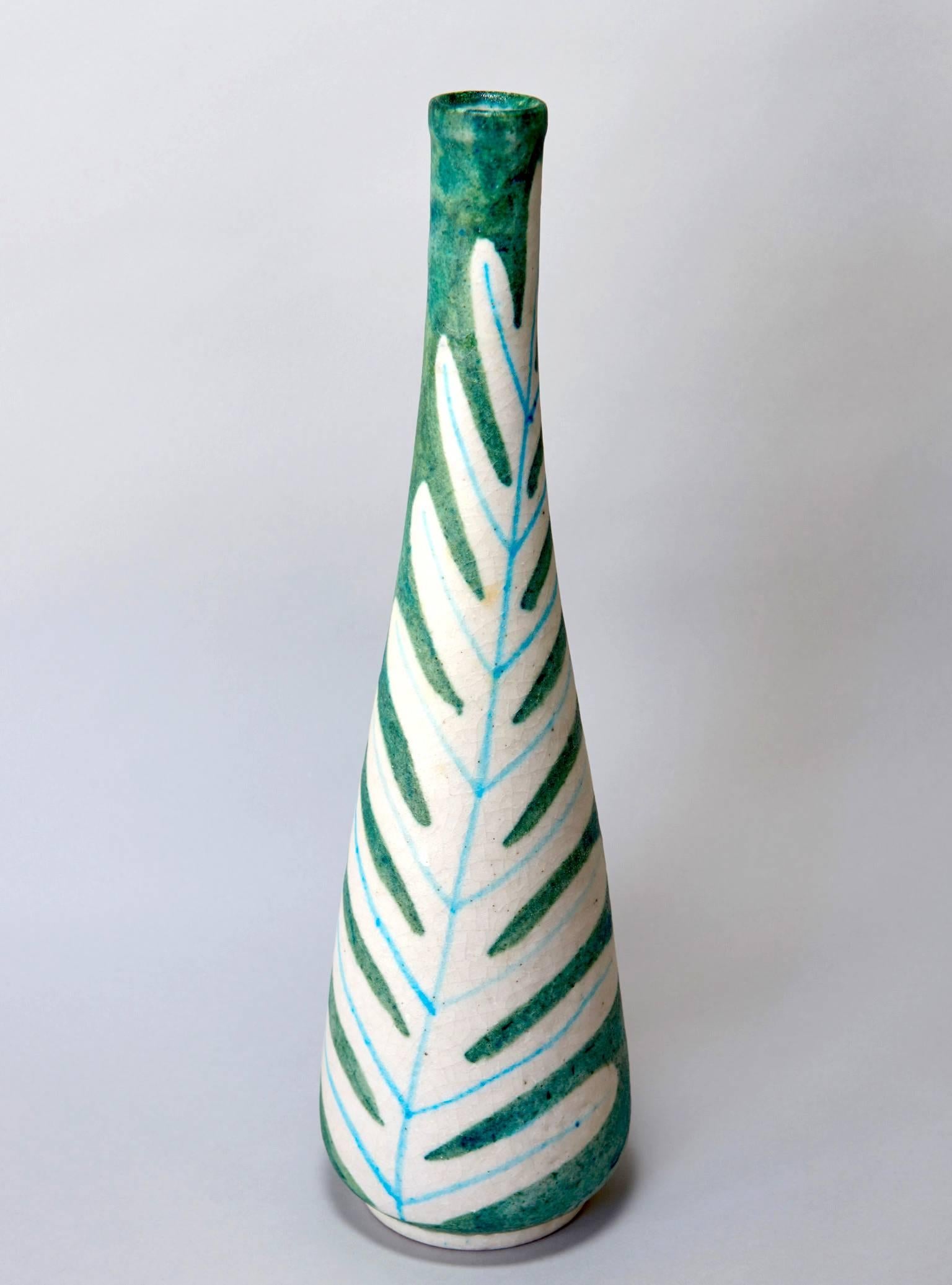 A tall vase by the greatest Italian ceramist of the post-war period. A stylized leaf decorates one half of the surface of the vessel, the other side being a variegated color field in a very lovely green. Signed GAMBONE ITALY with the artist's famous