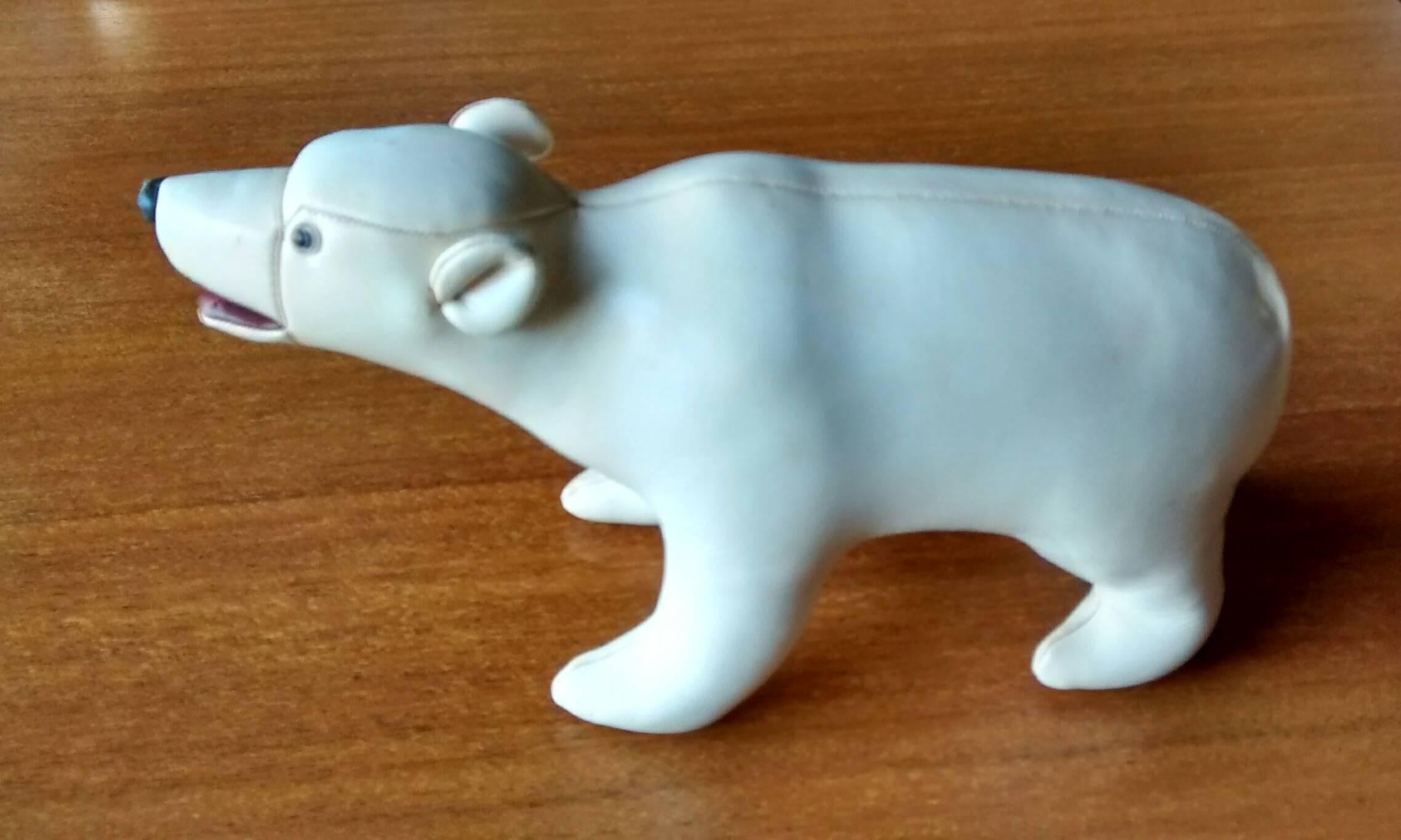 Kid glove leather covered polar bear figure by Tomi of Japan, dating to the 1960's. Similar quality to the Abercrombie leather pigs you see frequently. 

The tactile nature of this little figure can't be underestimated when you see it. Soft,