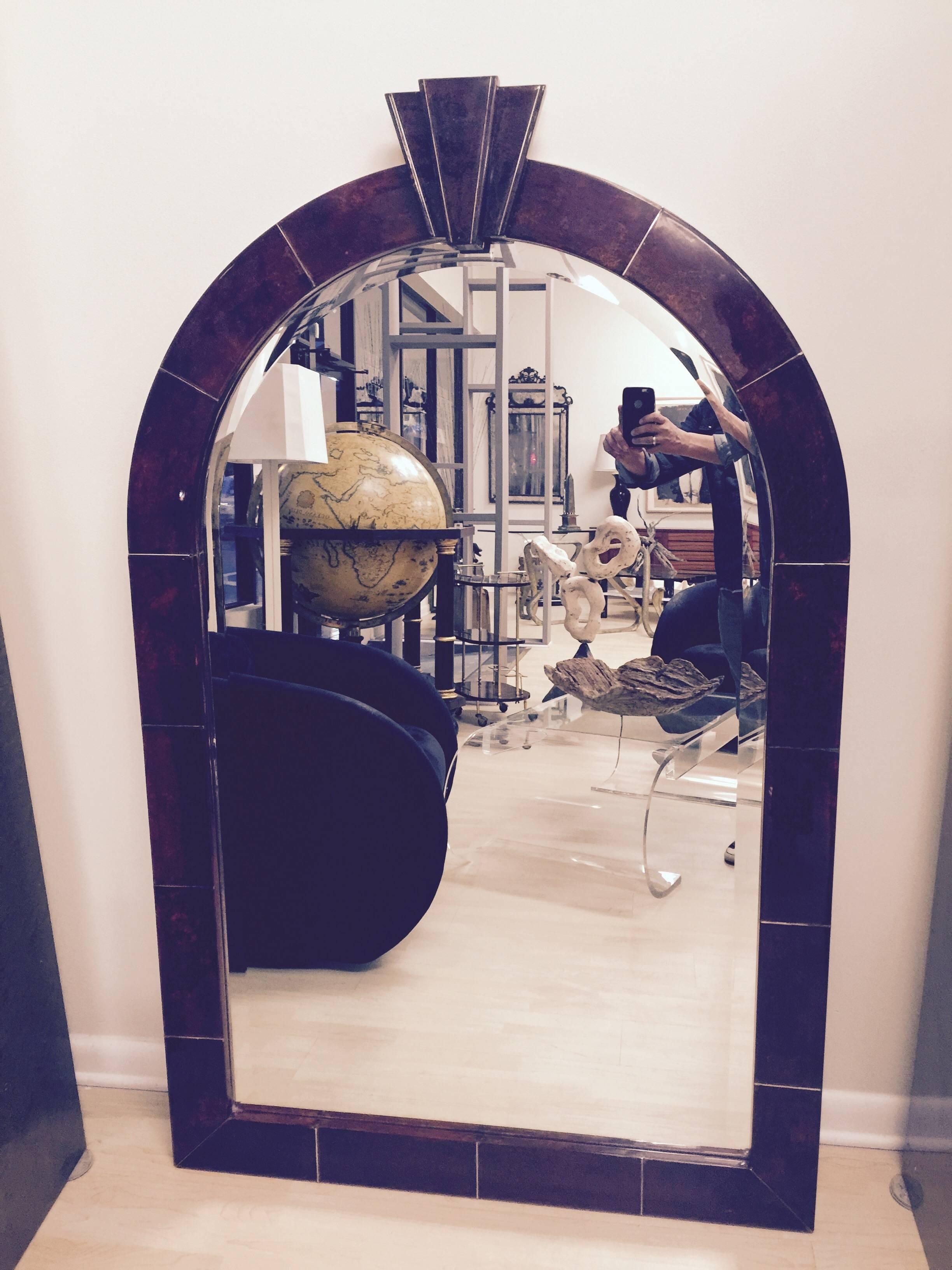 The mirror is very large. 62.5 high and 39.5 wide. The goatskin is perfect. It is signed on the back.