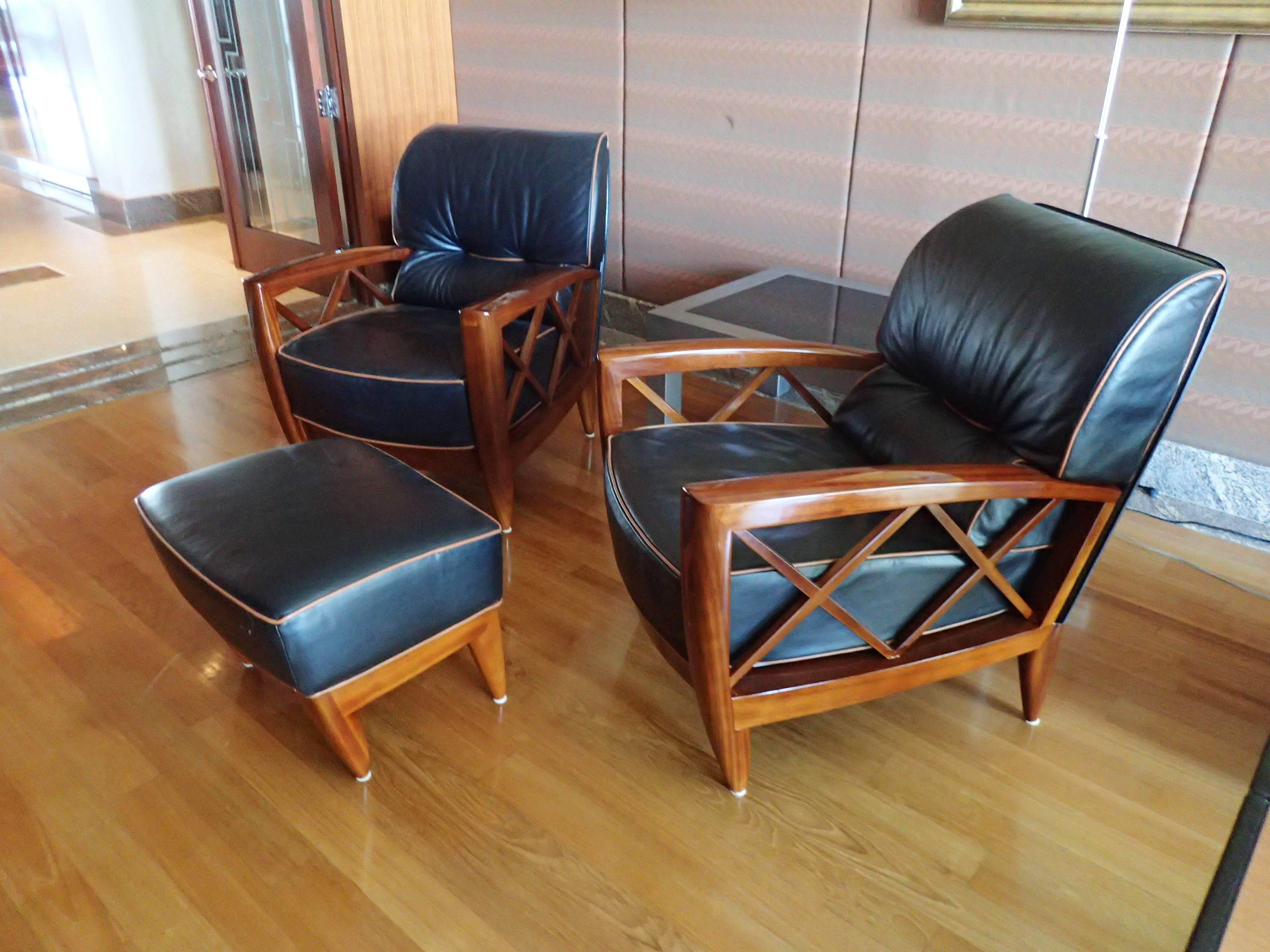 This beautiful pair of pace chairs have the original leather and wood finish. They are in excellent condition. The leather is black with tan piping.