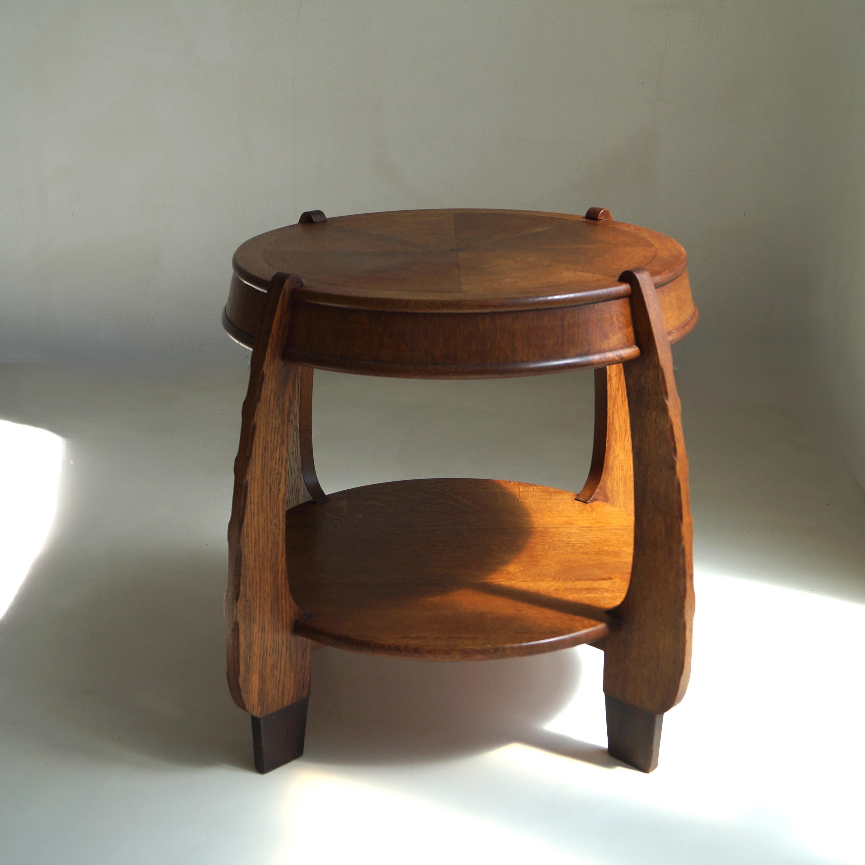 Documented in the renowned reference book Living in the Amsterdam School, this sculptural oak side table - originally known as a “lamp table” - is a striking example of early 20th-century Dutch design. It was produced by N.V. Hero de Groot, a wood