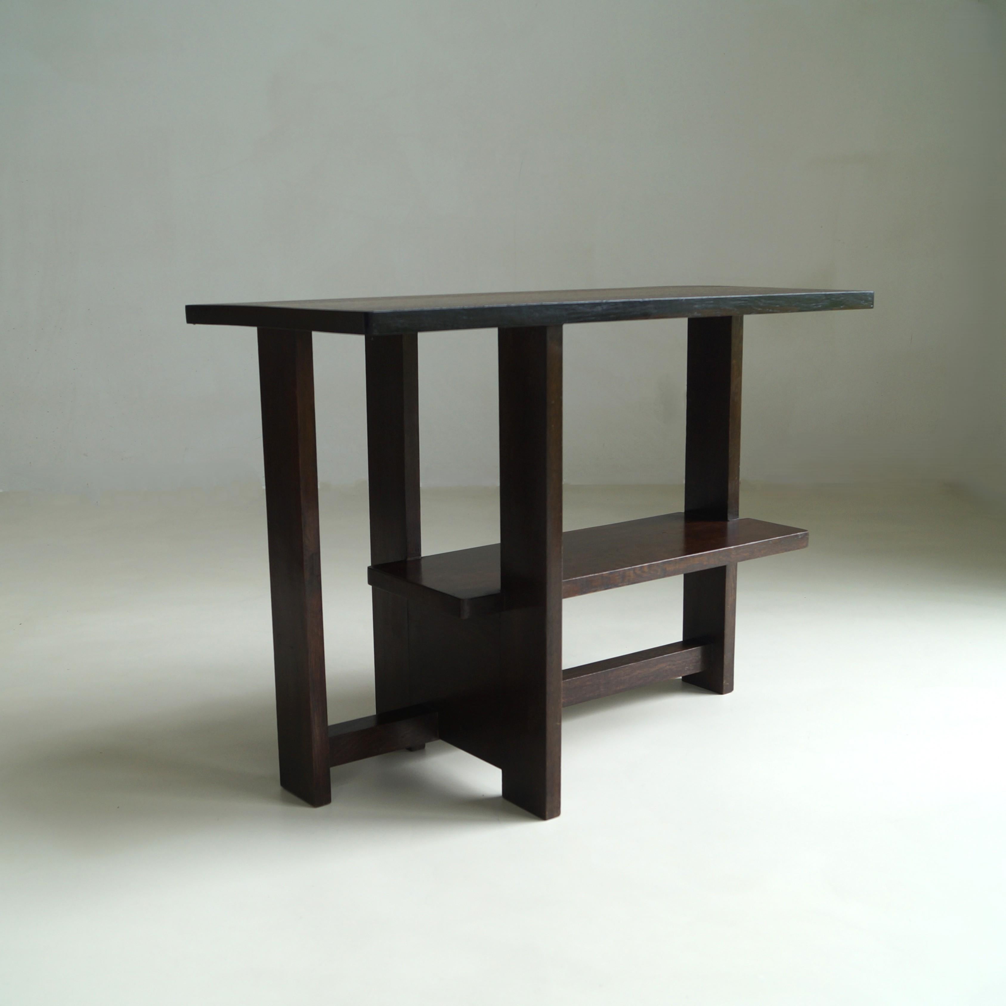An elegant example of early Dutch modernism, this asymmetrical console table reflects the influence of The Hague School, with clear stylistic references to the work of Frits Spanjaard and Cor Alons. Its clean geometry, thoughtful proportions, and