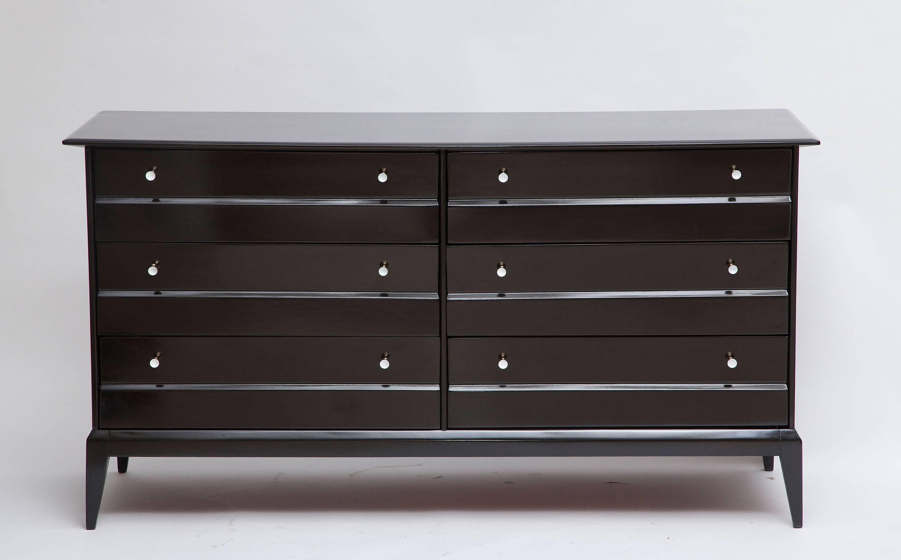 Snappy, clean-lined, six-drawer dresser by Heywood-Wakefield. Ebonized walnut and original, cute-as-a-button solid brass knobs with white enamel centers. Newly re-finished.