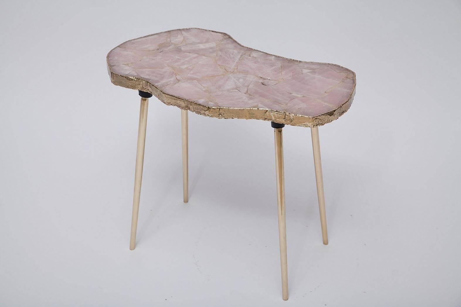 Romantic and rugged - organic rose quartz side table. Rose quartz specimens set in resin with brass soldered free edges and brass finished legs.
