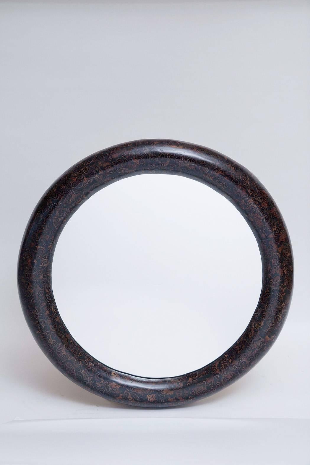 Rich black and brown bull-nosed mirror of resin and palm root inlay by Enrique Garces, Colombia circa 1980. Professionally restored.