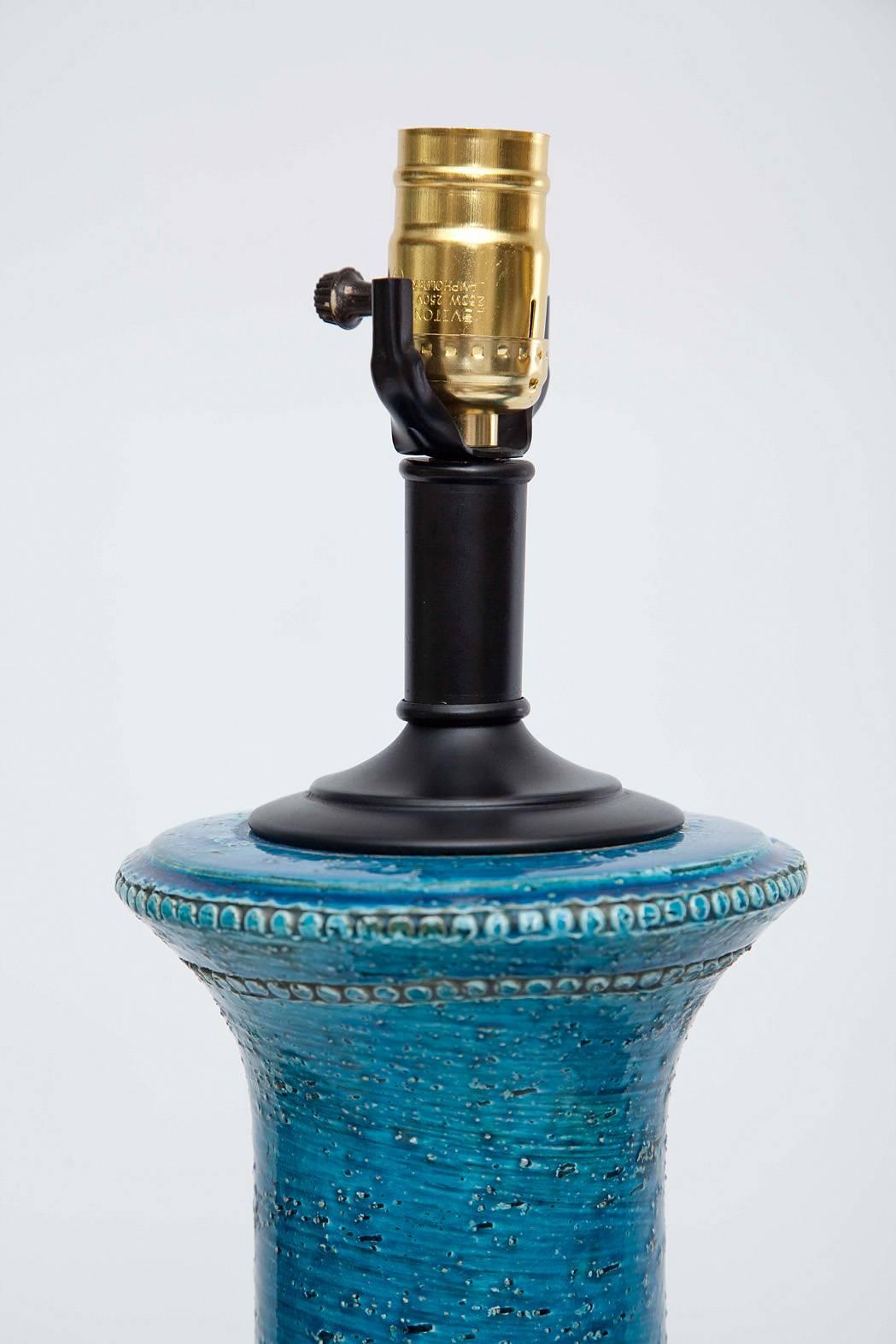 Vivid turquoise glazed ceramic lamps on black metal bases, designed by Aldo Londi for Bitossi.