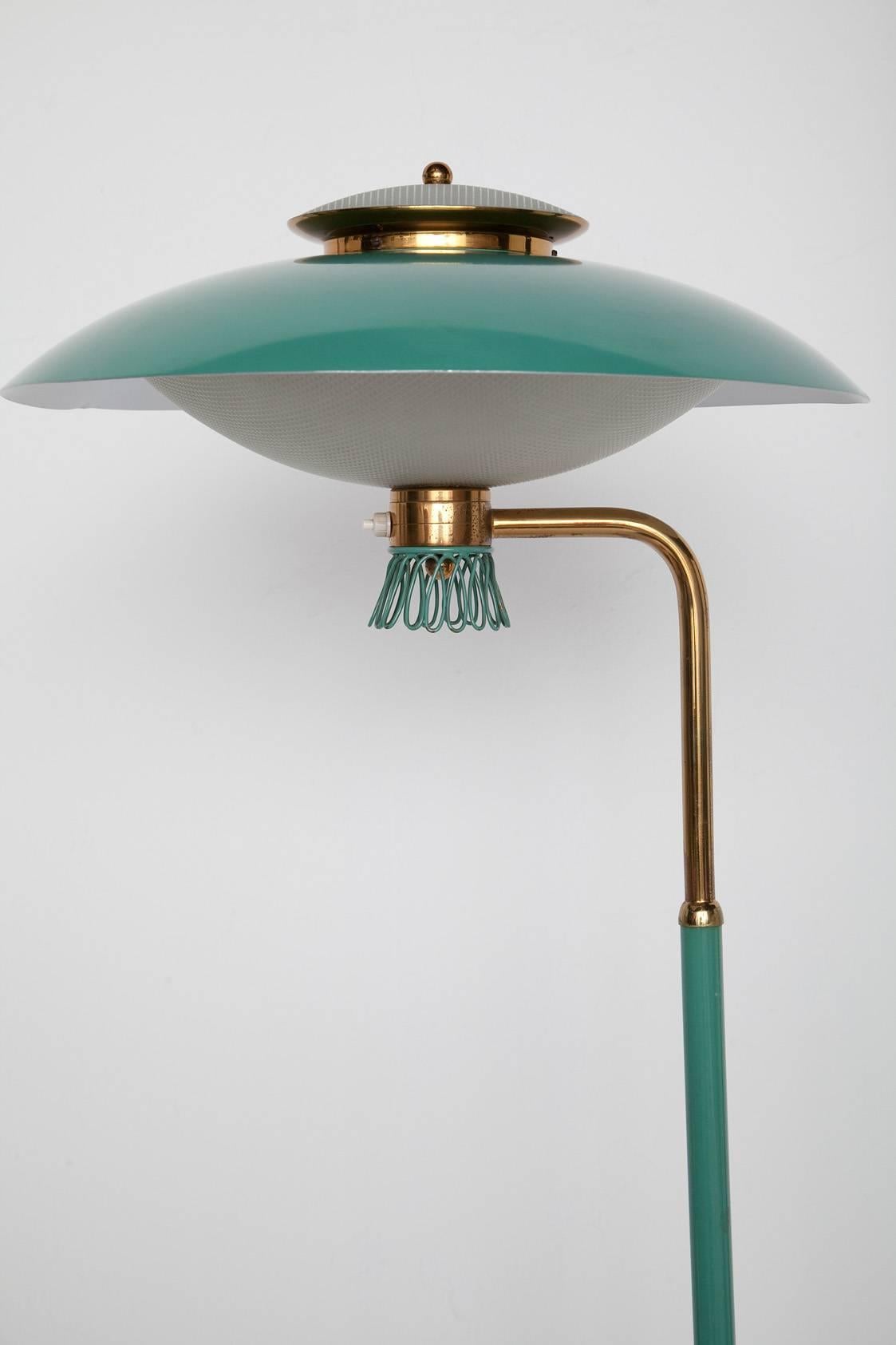 1950s Italian floor lamp in original swoon worthy green enameled metal with original waffled glass diffusers, solid brass hardware and an incredible green glass base, 1.25 inches thick. This lamp charms even down to the white scalloped light sockets!