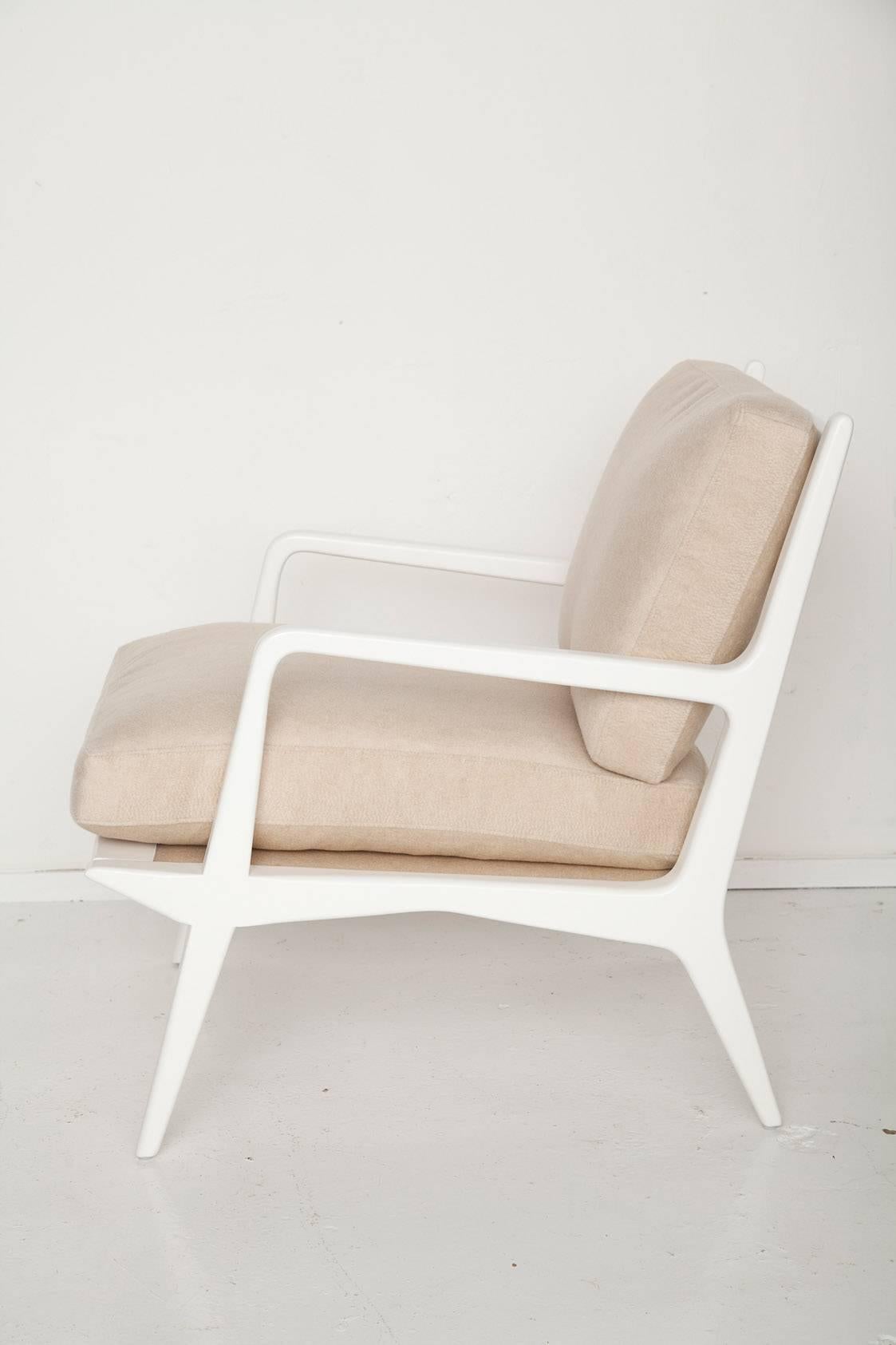 Designed by Carlo Di Carli for M. Singer & Sons, circa 1955, we've given this chair a fresh, luxe update, accenting the wonderful lines of its frame in cream lacquer, and upholstering custom down-wrapped seat and back cushions in soft, palest