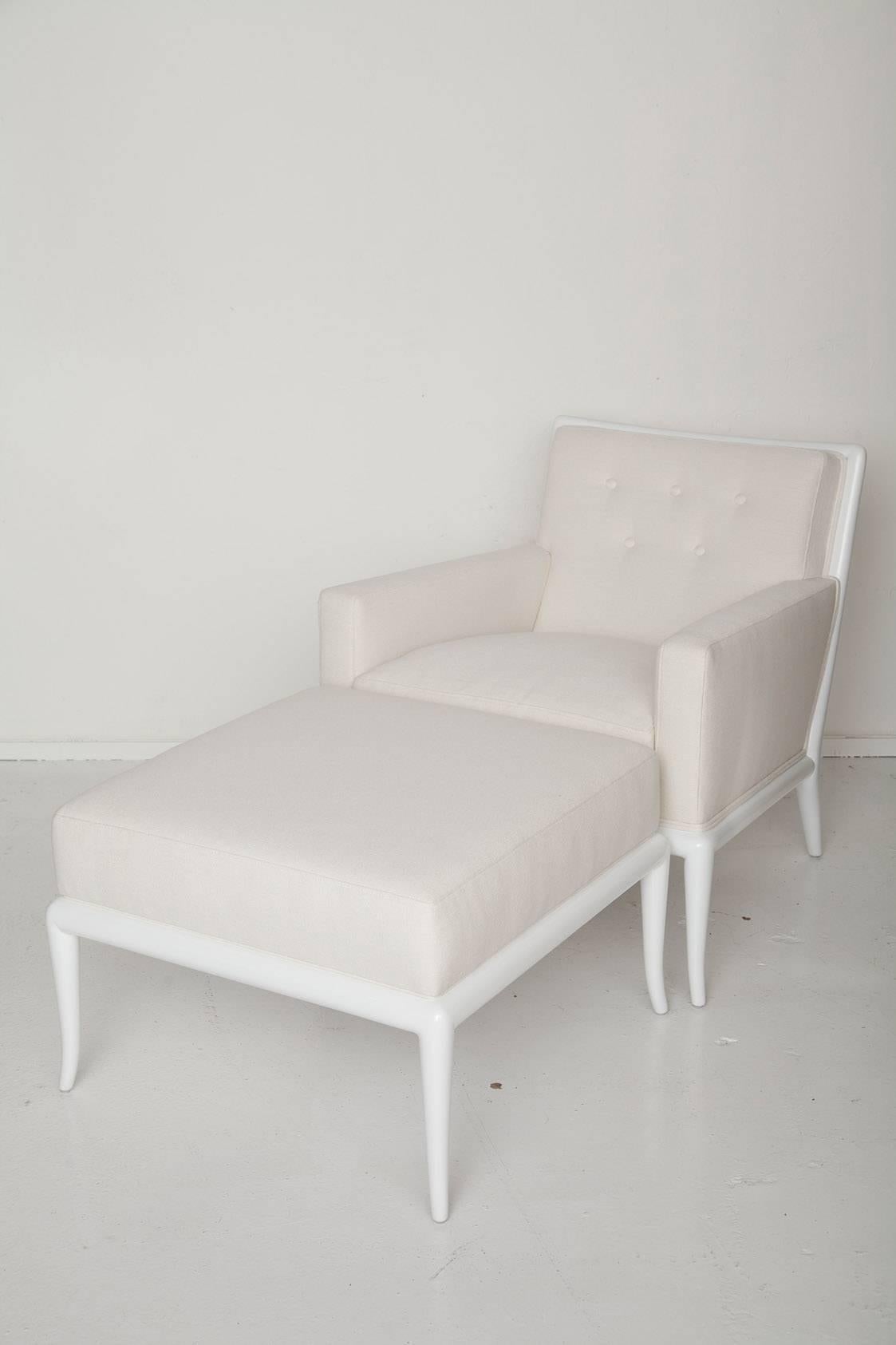 Chic white lacquered saber leg lounge chair and ottoman designed by T.H. Robsjohn-Gibbings for Widdicomb, circa 1950. Upholstered in a Kravet Couture textured off-white linen. We've added a down wrap to the seat cushion for luxe comfort.