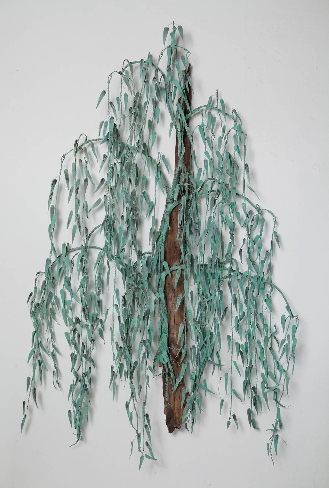Patinated verdigris copper and natural driftwood combine to give this 1970s willow tree wall sculpture captivating color, texture, and shadow play.