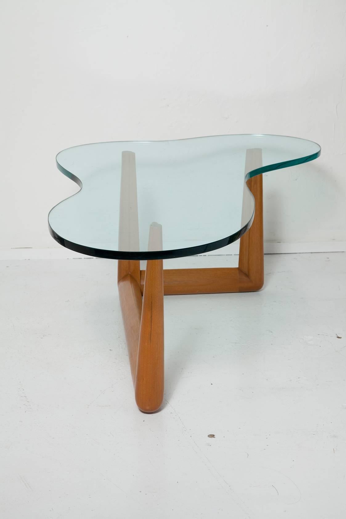 Timeless, Classic Mid-Century Modern biomorphic coffee table By T.H. Robsjohn-Gibbings For Widdicomb with gorgeous original green glass top.