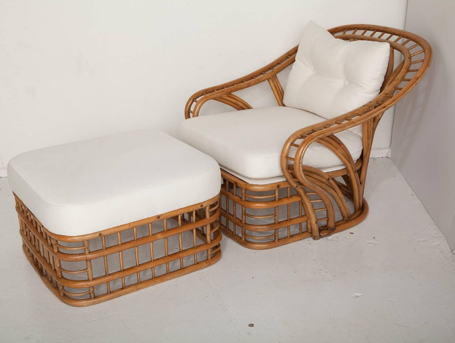 This classic and curvaceous fully restored 1970s bamboo lounge chair and ottoman, newly upholstered in a soft all-weather oxford cloth, looks as good from the back as it does from the front. Ottoman measures H 14 in. x W 24 in. x D 24 in.
