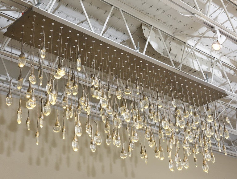 Dazzling 112-light Seed Cloud chandelier by British design firm, Ochre, whose partners are Joanna Bibby, Harriet Maxwell MacDonald, and Solenne de la Fouchardière. Each cast bronze and tempered glass pendant houses its own single-watt LED bulb.