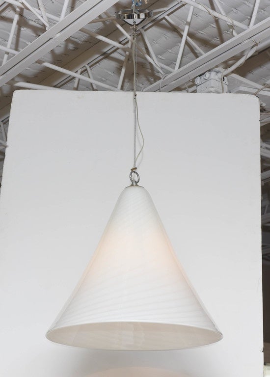 We love the simplicity and scale of this impressive 1970s white-on-white, handblown Vetri Murano pendant light. Single socket, 100 watt maximum. Height measurement below is for glass portion only and does not include an additional 20 inches of cable