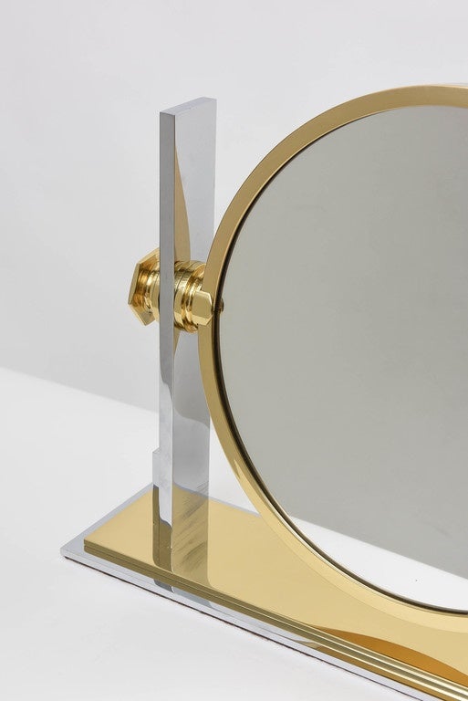 Coveted chrome and brass vanity mirror by Karl Springer. 13.5