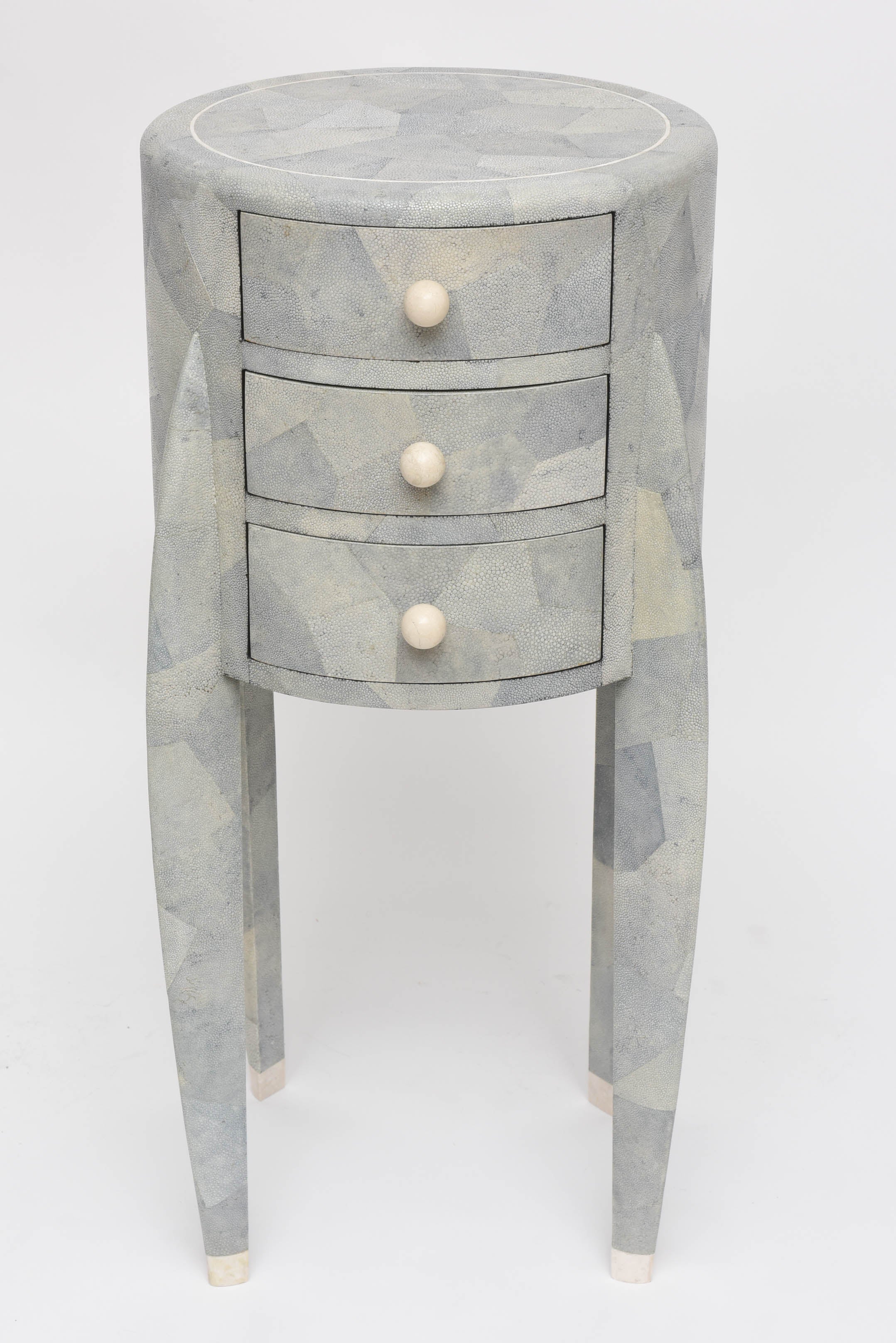 Shades of pale grey, and green all come through in this diminutive patchwork shagreen chest of drawers with creamy bone and stone accents, by Maitland-Smith.