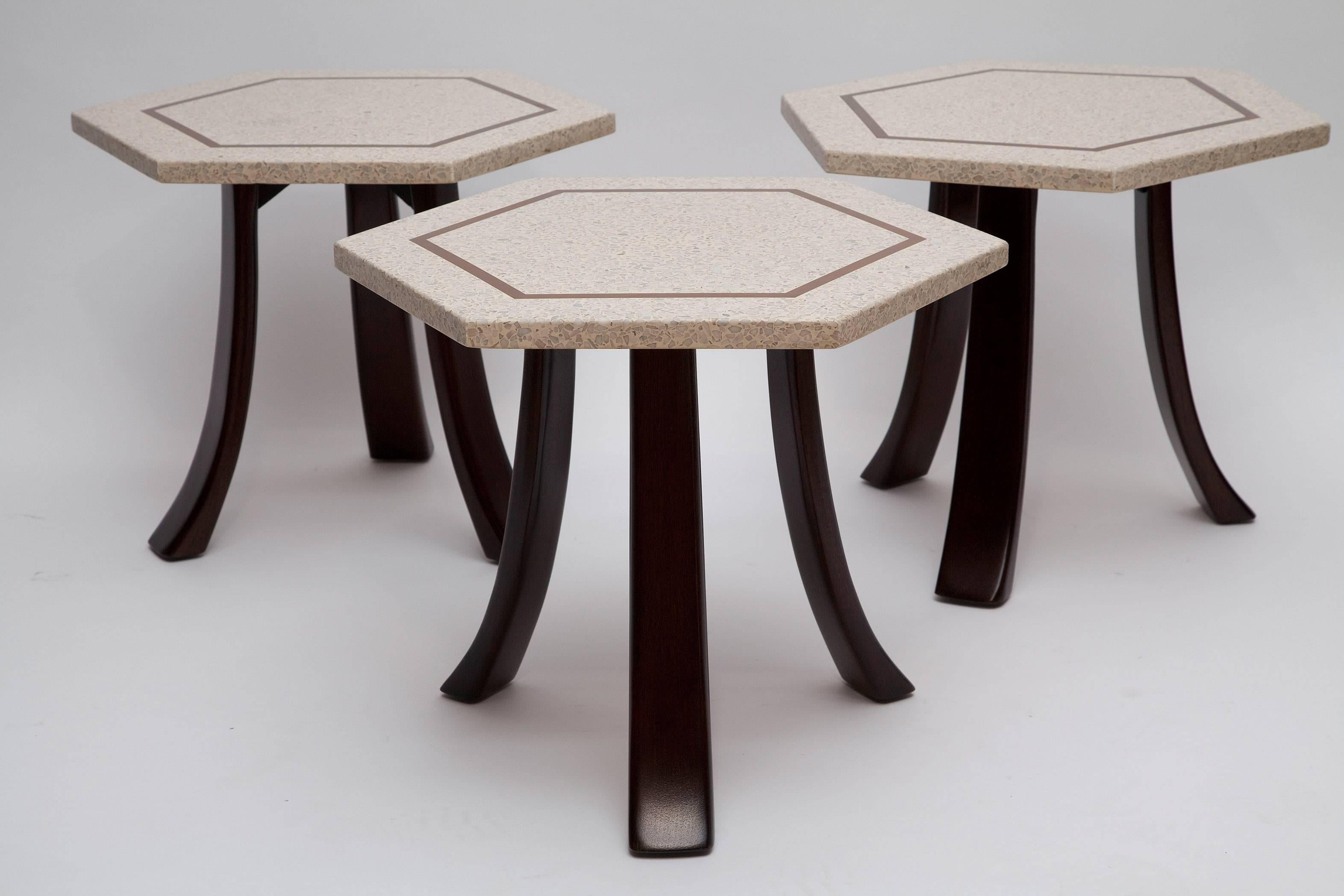 Hexagonal side table by Harvey Probber. Brass inlaid terrazzo top in neutral colors of grey, cream, and sand. Newly refinished mahogany legs in dark walnut color. Excellent condition. (Last one left!)