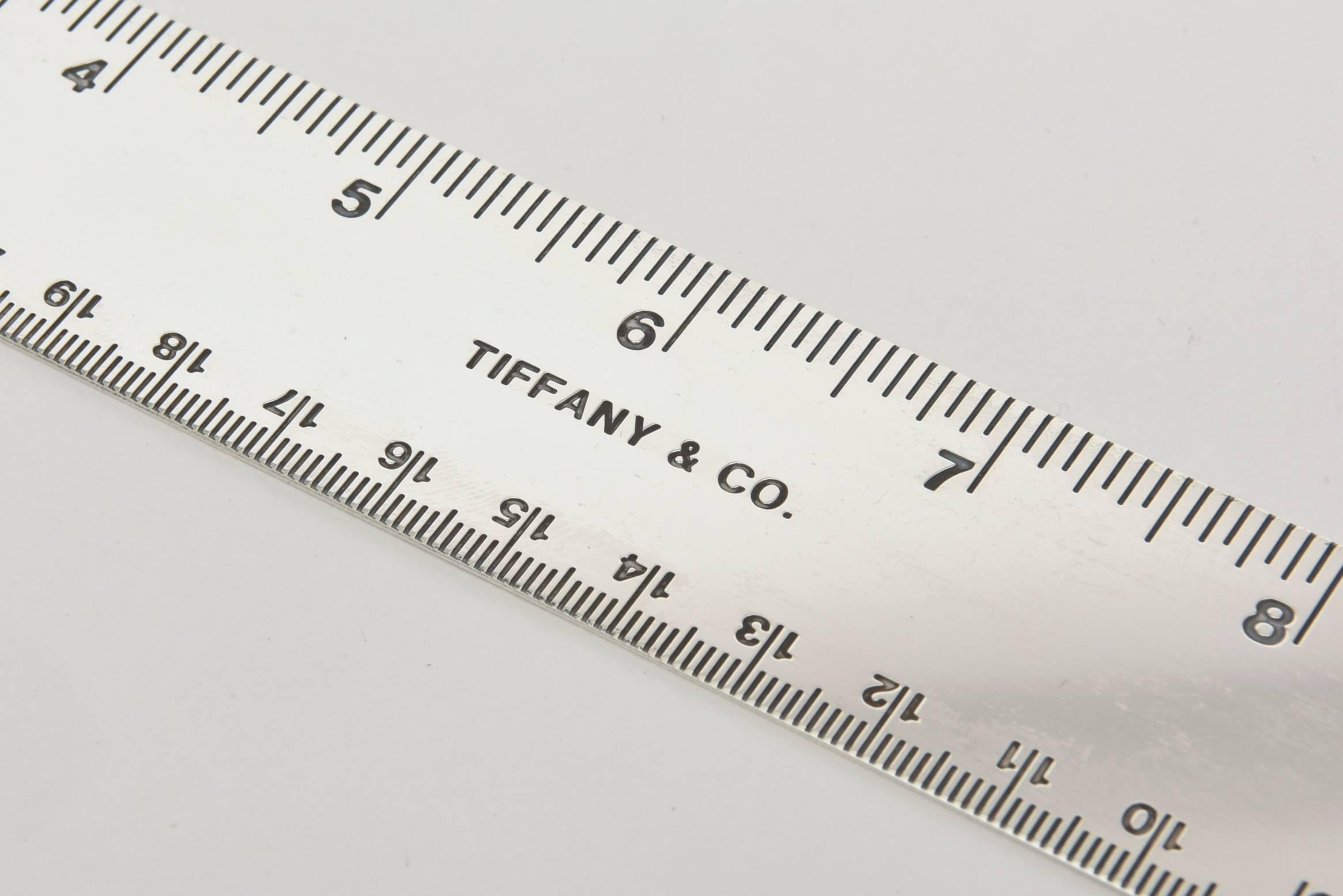 This Tiffany and Co. classic sterling silver ruler has its own original felt dust cover.
What a great desk accessory.
Tiffany has discontinued these a long time ago.
