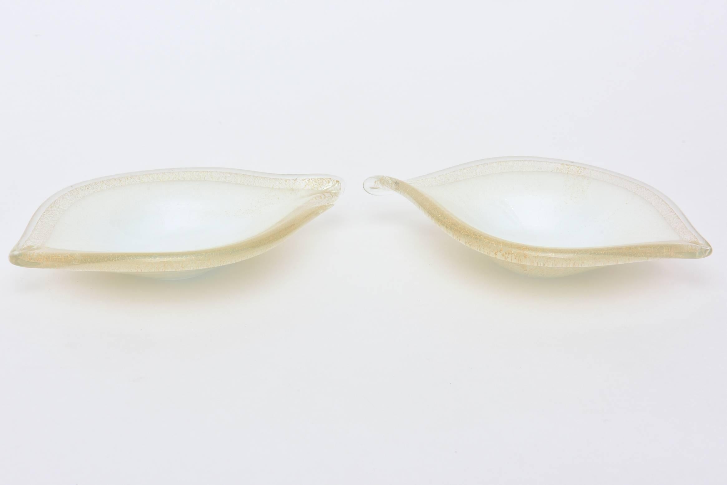 White case meets gold aventurine in these beautiful teardrop/almond shaped glass Italian murano bowls by Barovier e Toso. The gold aventurine is abundant on the sides and bottom.
They are perfect for serving.
The beauty does not show up in the