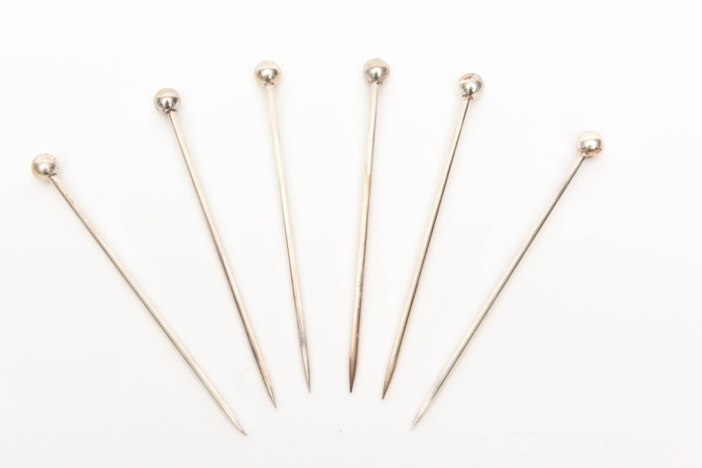 These set of six vintage silver plate chic modern sculptural long serving picks or cocktail picks have their own original box which is quite elegant. Their tipped silver balls add easiness in picking up for serving. The company is Ercuis Paris