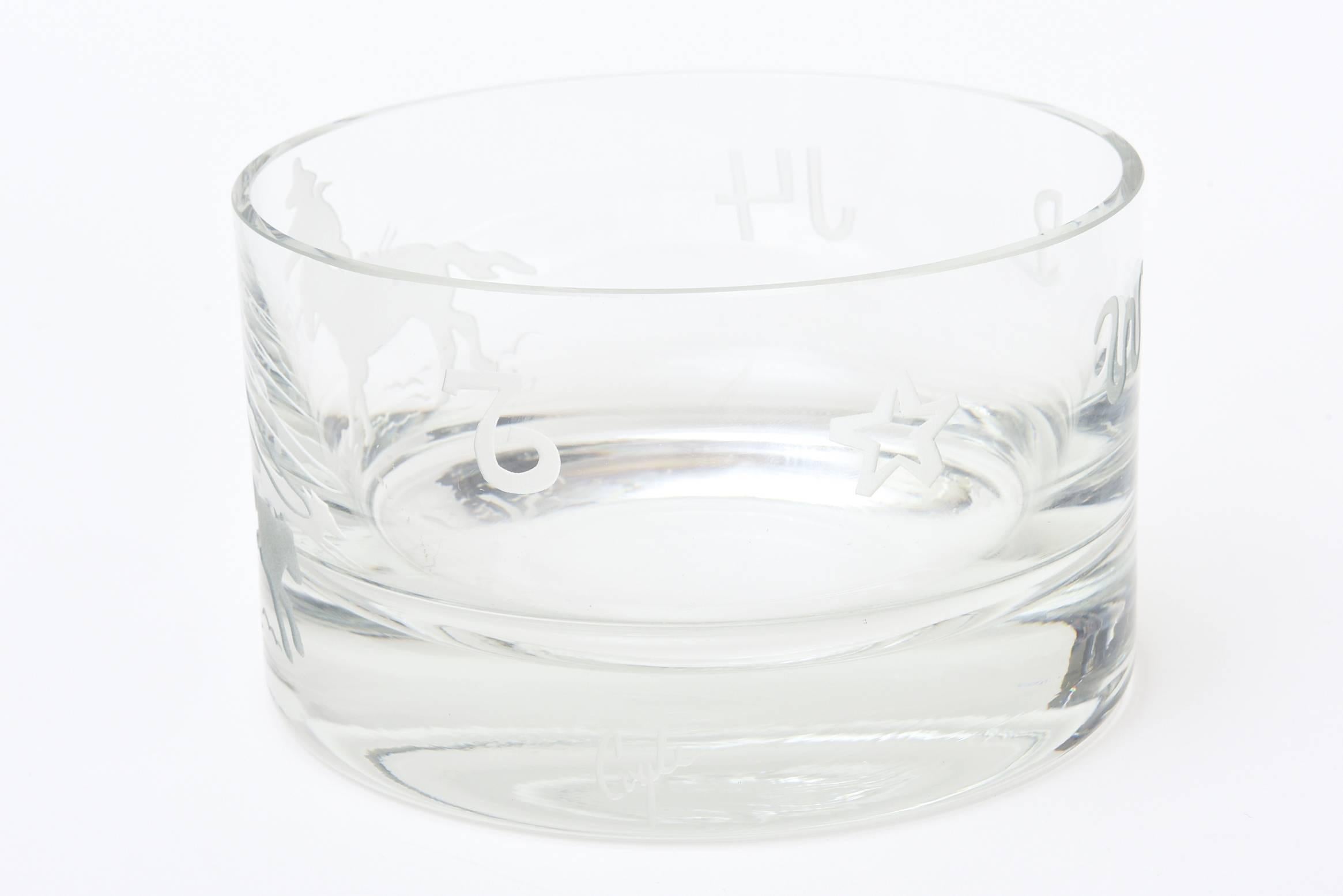 This artist signed crystal bowl has intaglio etched horses and cowboys riding all-over the perimeter of this gorgeous bowl. It is signed by Perry Coyle for Mireau Crystal Co. He is a master glass engraver who engraved this bowl with the rhythm of