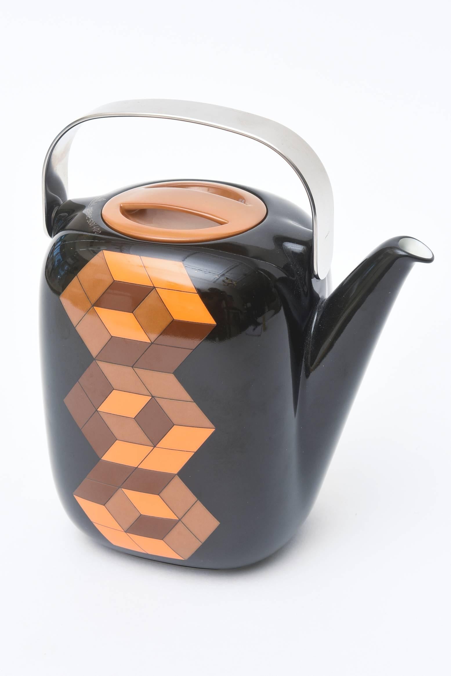 This lovely and arresting optical hallmarked teapot with a stainless steel handle,
was designed by Victor Vasarely for Rosenthal. It is hallmarked in two places and is a limited edition of 500. This is signed 400/500.
The color palette is more