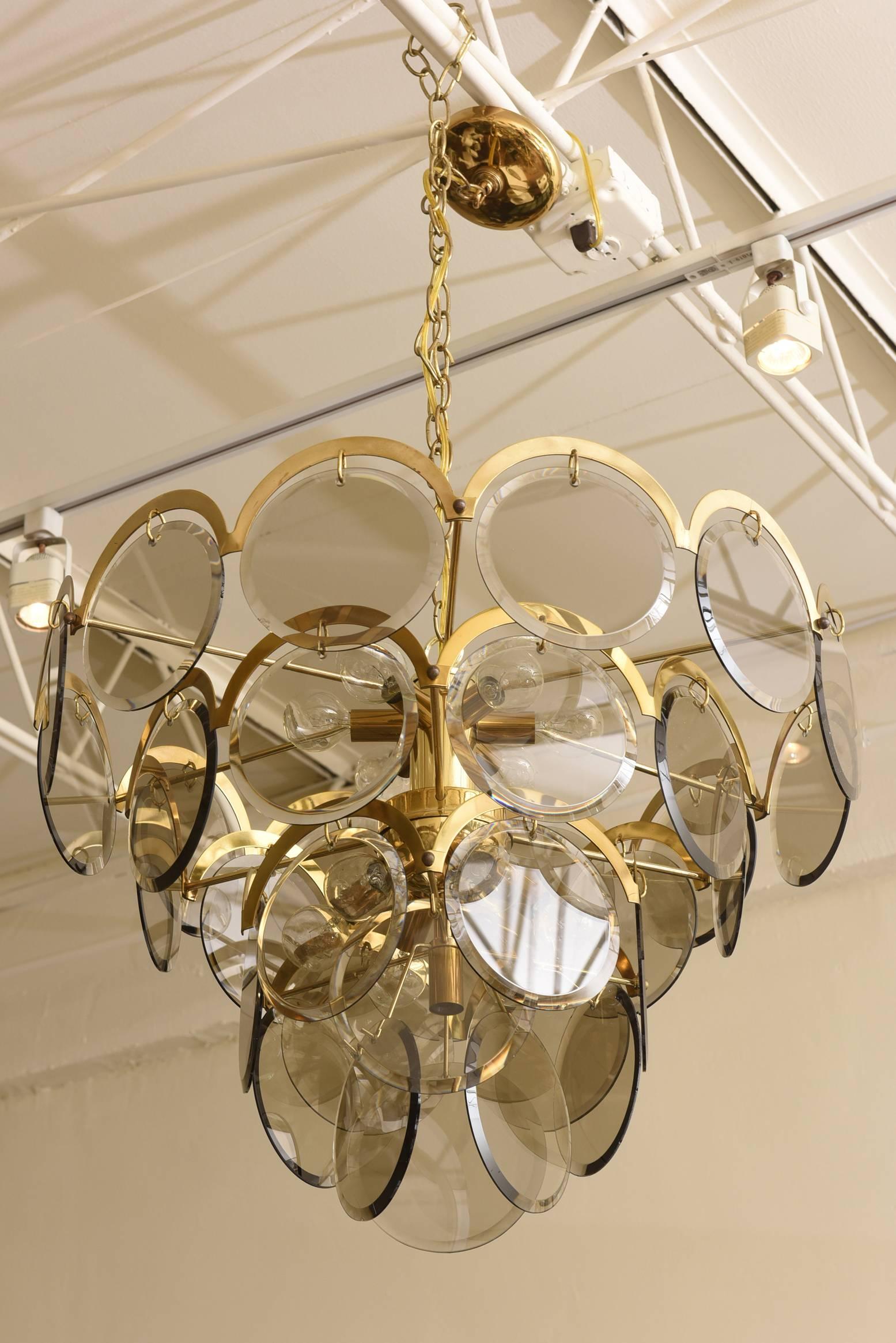 Four layers and four levels of this fantastic Italian Murano smoked gray glass beveled disks hang on this vintage Vistosi chandelier. Each glass disk is 6