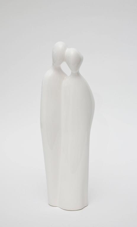 This tall vintage sculpture and or object of an abstract couple; man/woman in repose is white to off-white porcelain by Rosenthal Netter who was the manufacturer.  Part of the original label is still on the bottom. This is from the 60's.

