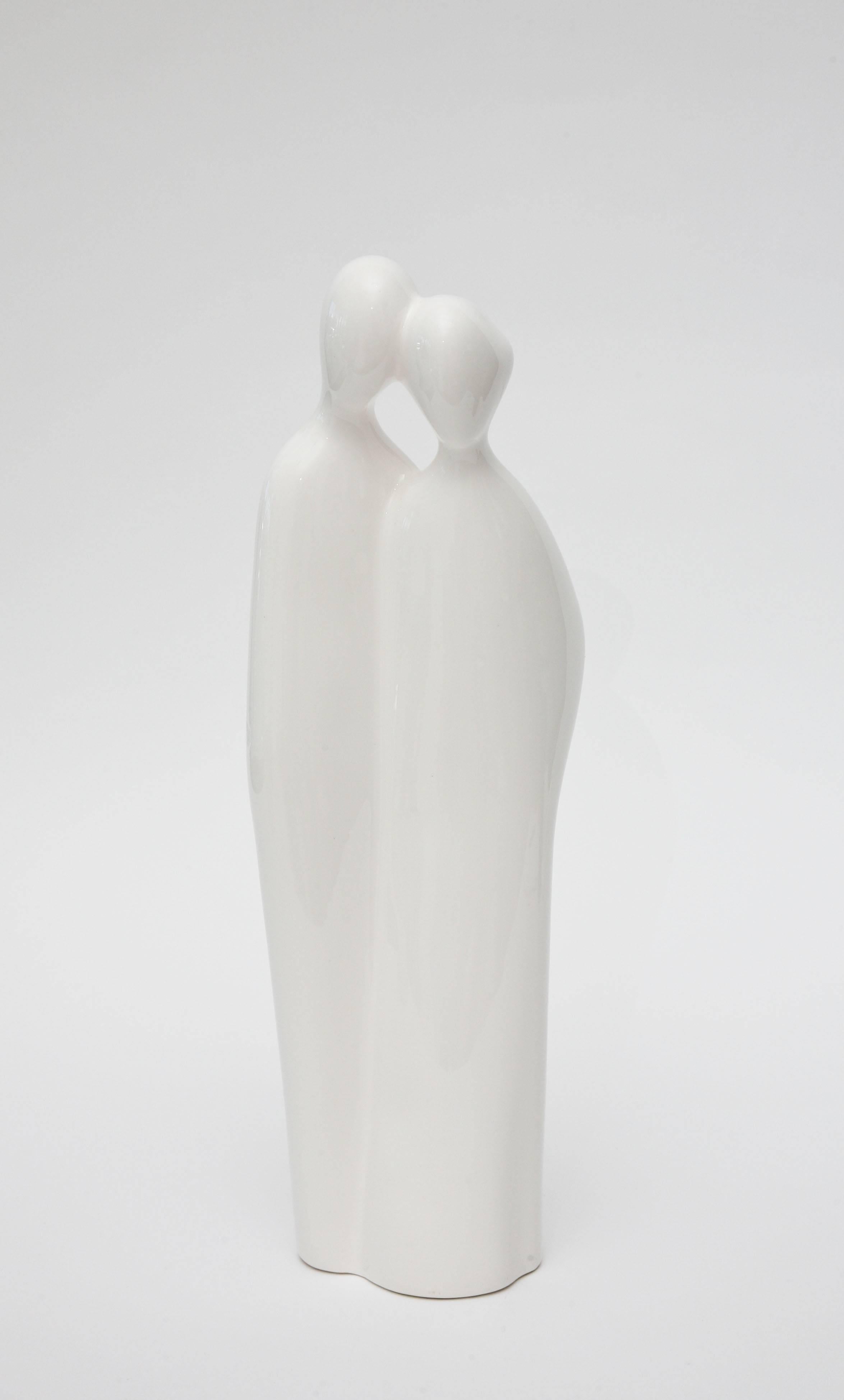 This tall vintage modernist sculpture and or object of an abstract couple; man/woman in repose is white to off-white porcelain by Rosenthal Netter who was the manufacturer.  Part of the original label is still on the bottom. This is from the 60's.

