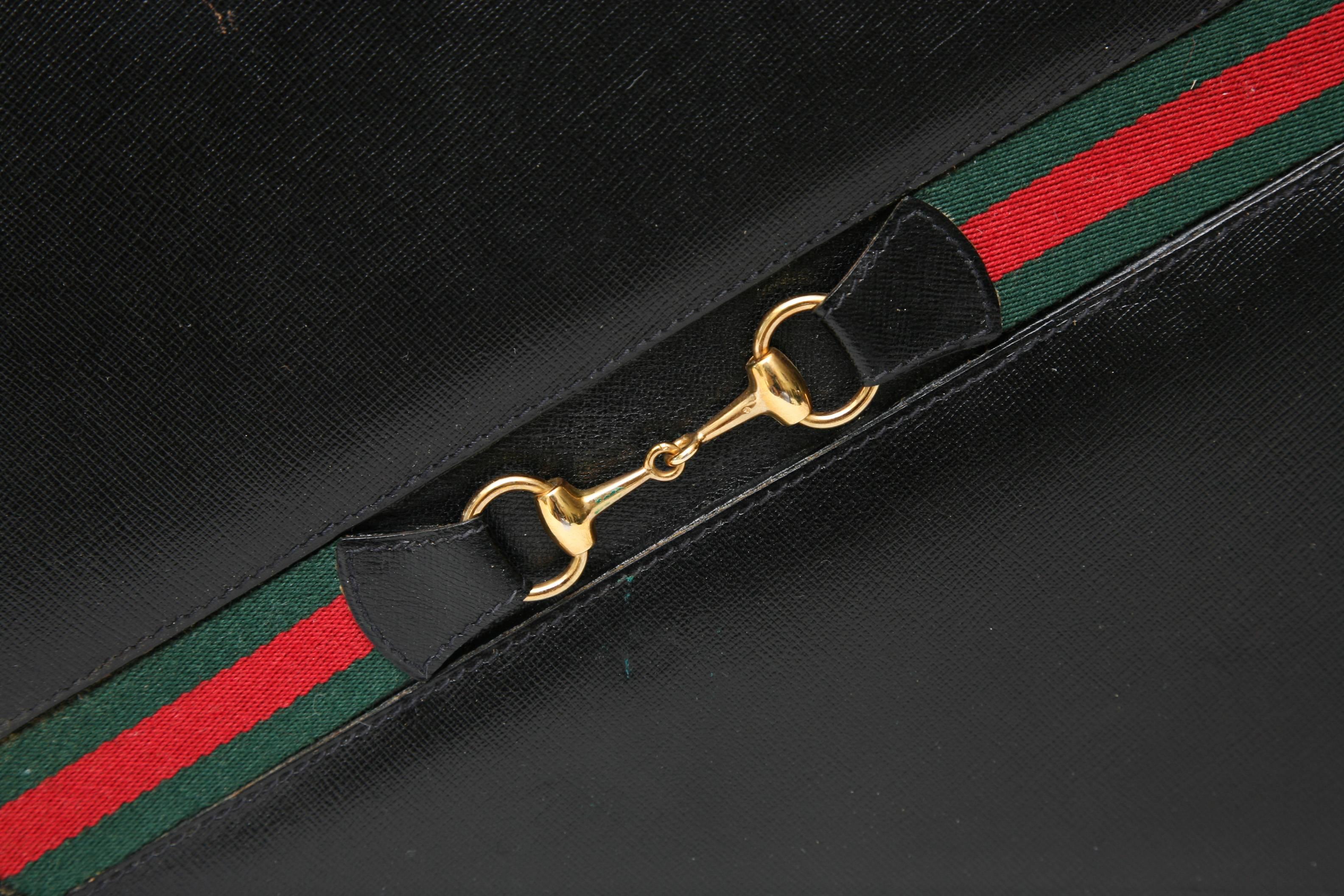 For the backgammon and Gucci lover, this wonderful vintage travel set can go anywhere. The case is black leather with the iconic Gucci colors and horse bit logo set into the front of the case. There is a key that locks the case shown on the front