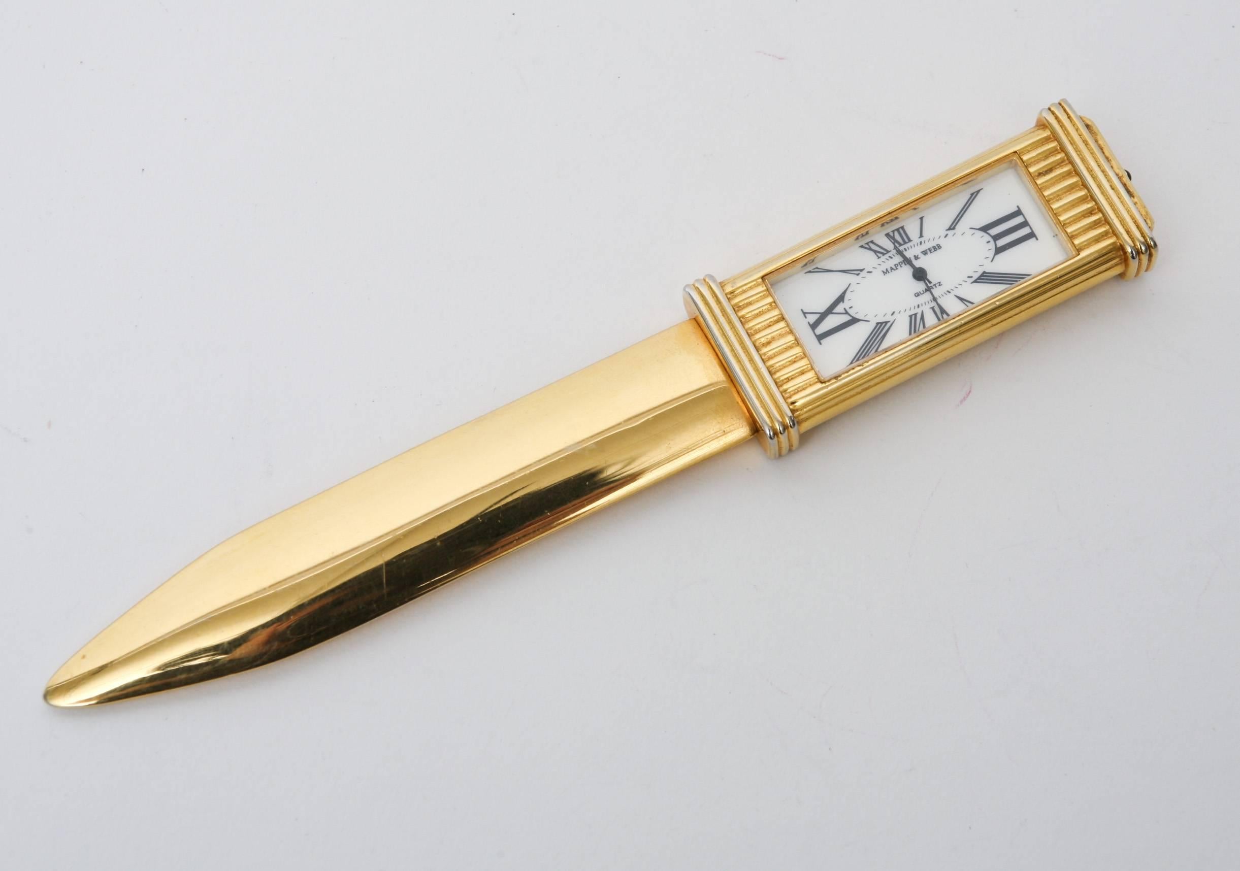 This rare and fantastic Mappin & Webb clock letter opener is finely made. The roman numerals on the clock give regality and a Cartier style. There is a glass
front to the clock.
It is 22-carat gold-plated. We have not re-plated this as it would