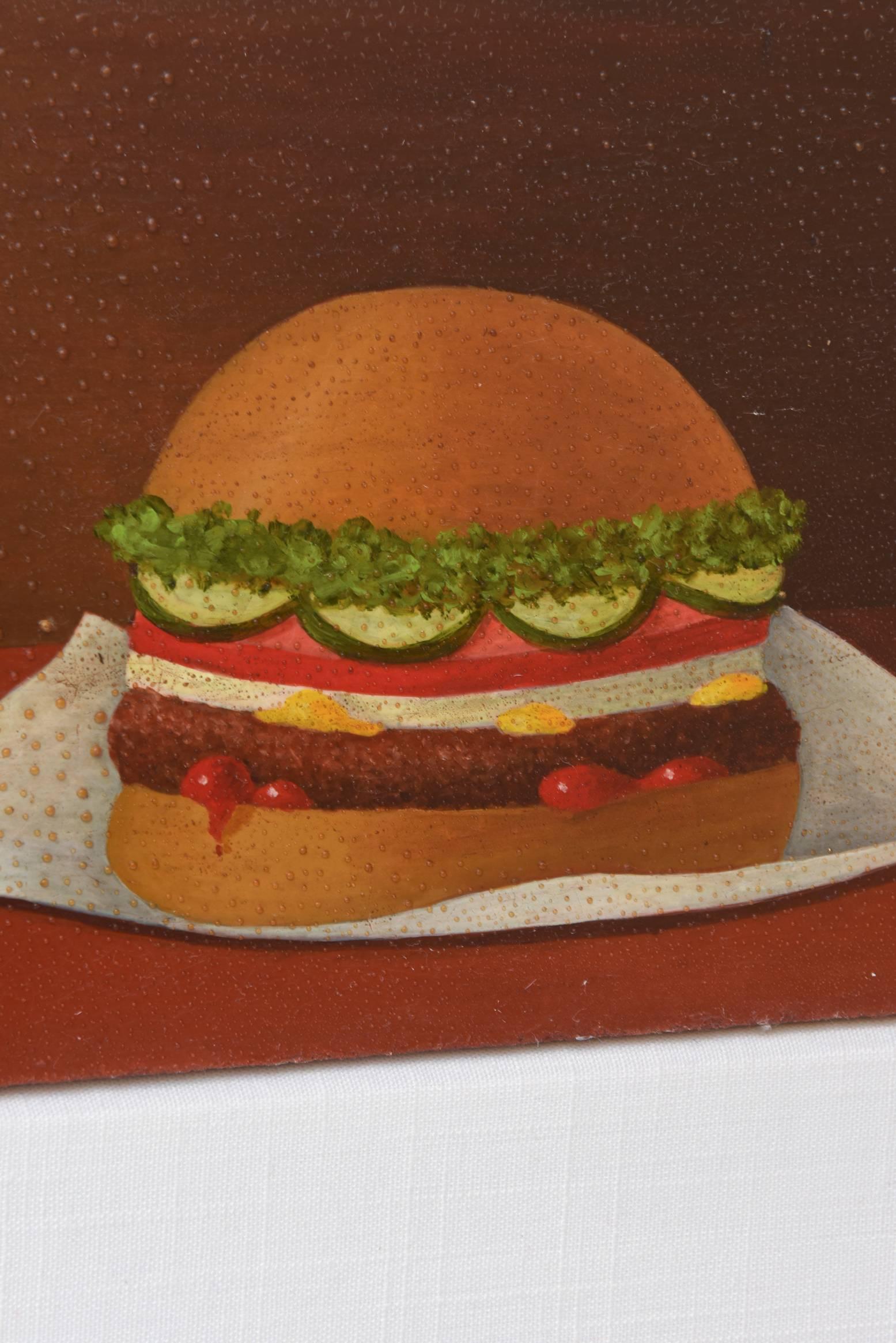 This 1960s vintage oil on board surrealist style painting is signed by Luis Idigoras. His roots are from Spain. He lived in NYC and is deceased.
The hamburger is so dimensional and it lends you to want to bite right into it.
It has been newly custom