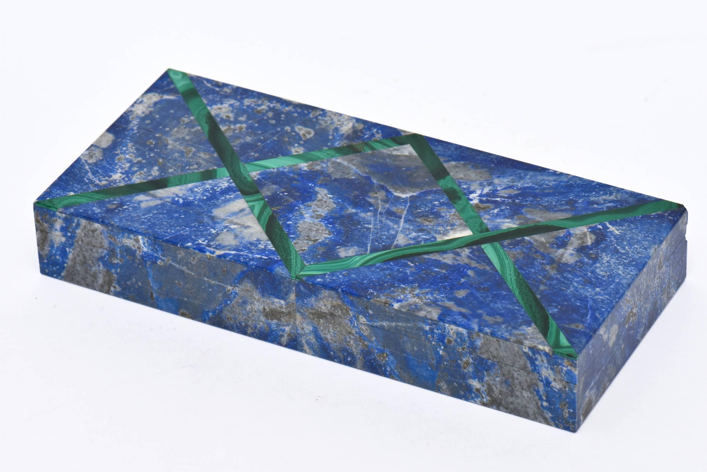 This gorgeous and unusual European hinged vintage box that is continental is a gorgeous combination of lapis lazuli and malachite X-formed diamond pattern. This is a very fine box and most unusual. This would be an elegant addition on a desk or
